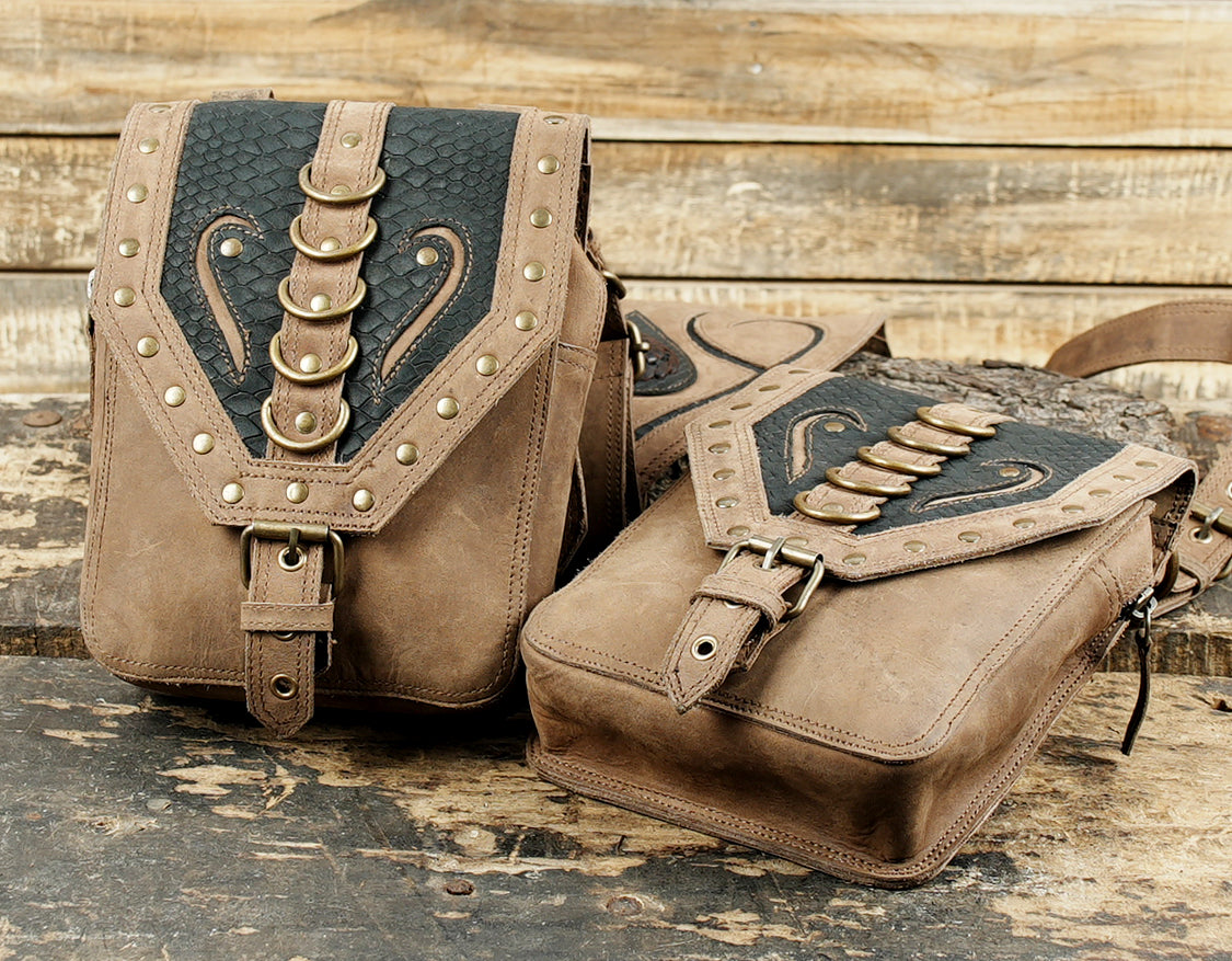 Rustic leather body holster with reinforced straps and metal rivets