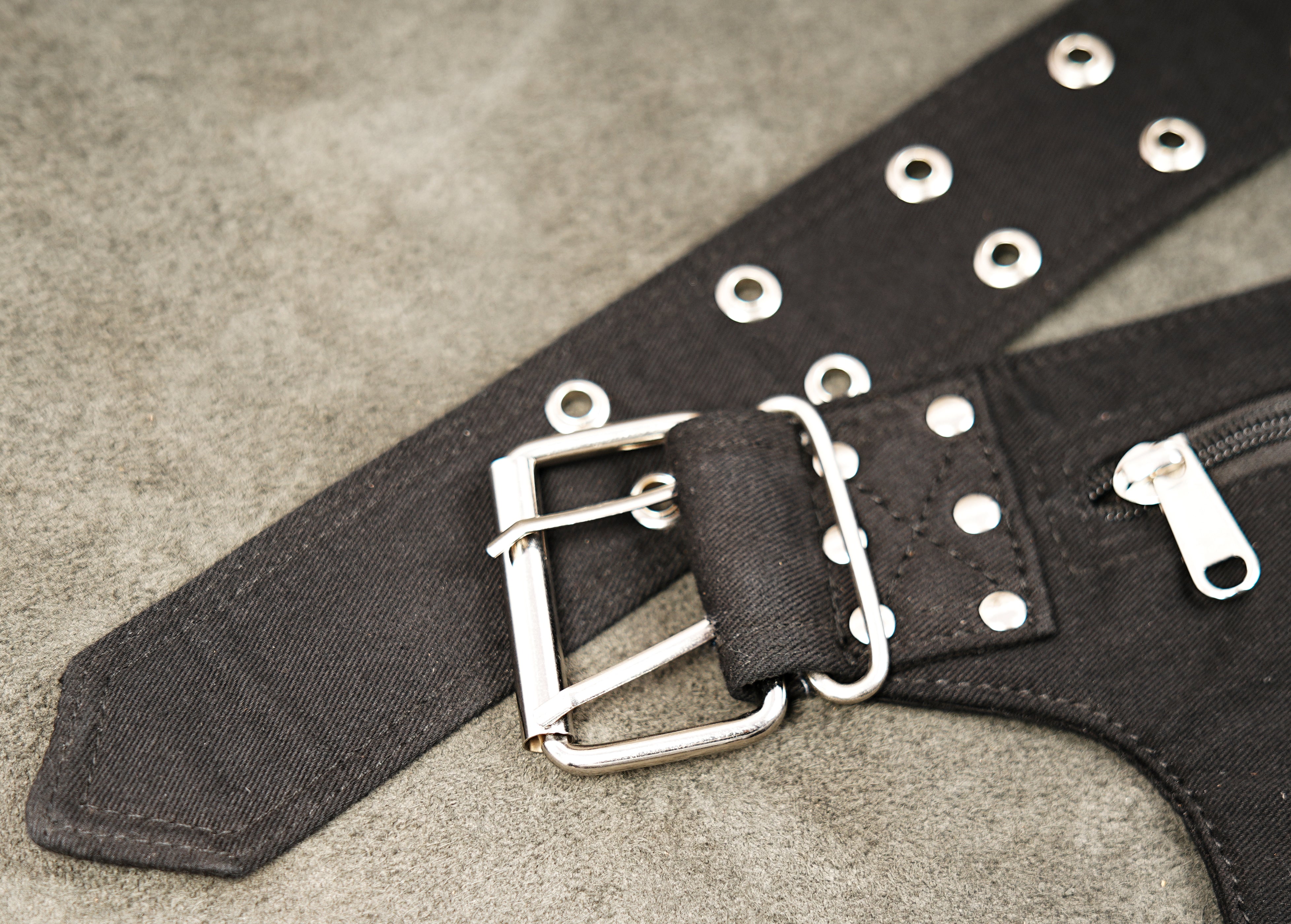 Rugged black multi-pocket pouch belt suitable for festivals and travel.