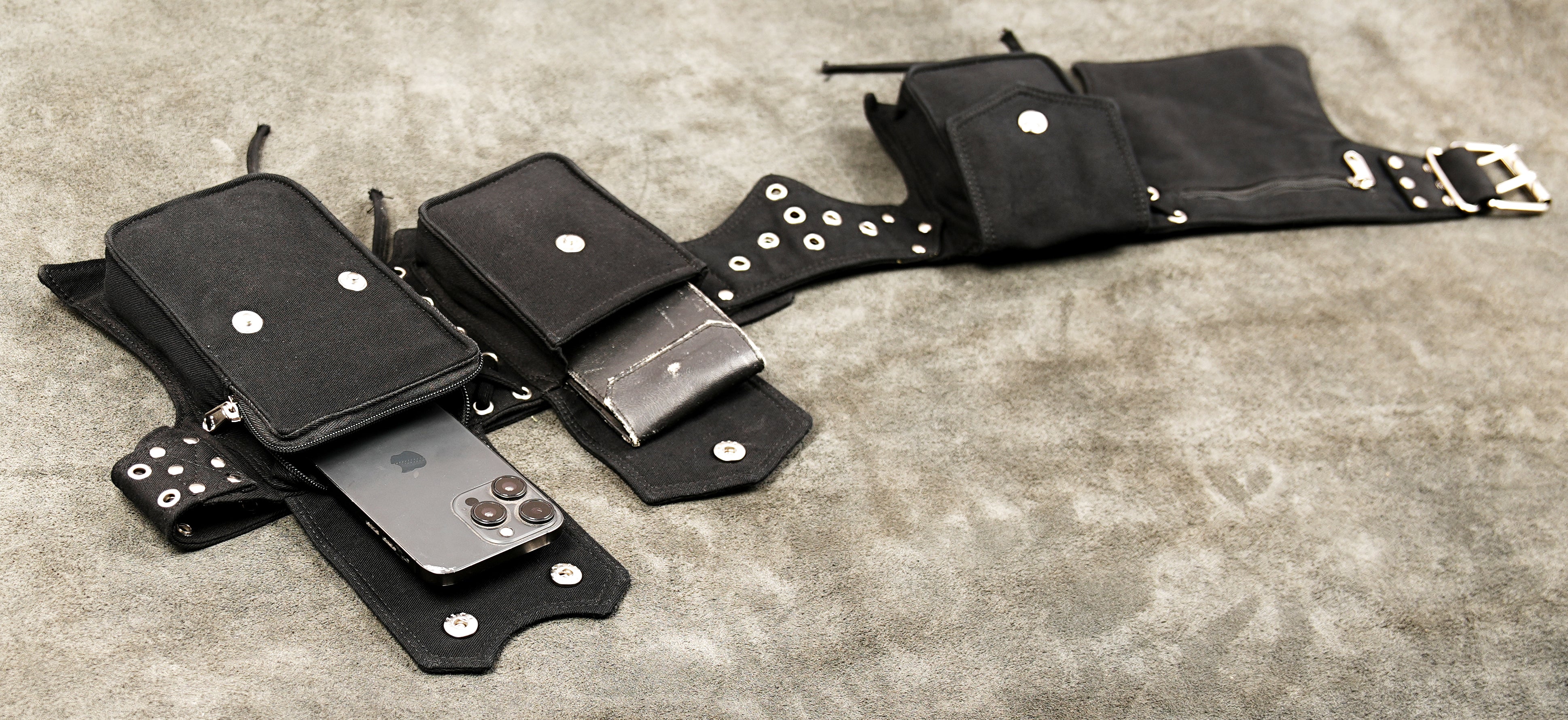 Dark alternative fashion black canvas utility belt with adjustable fit.