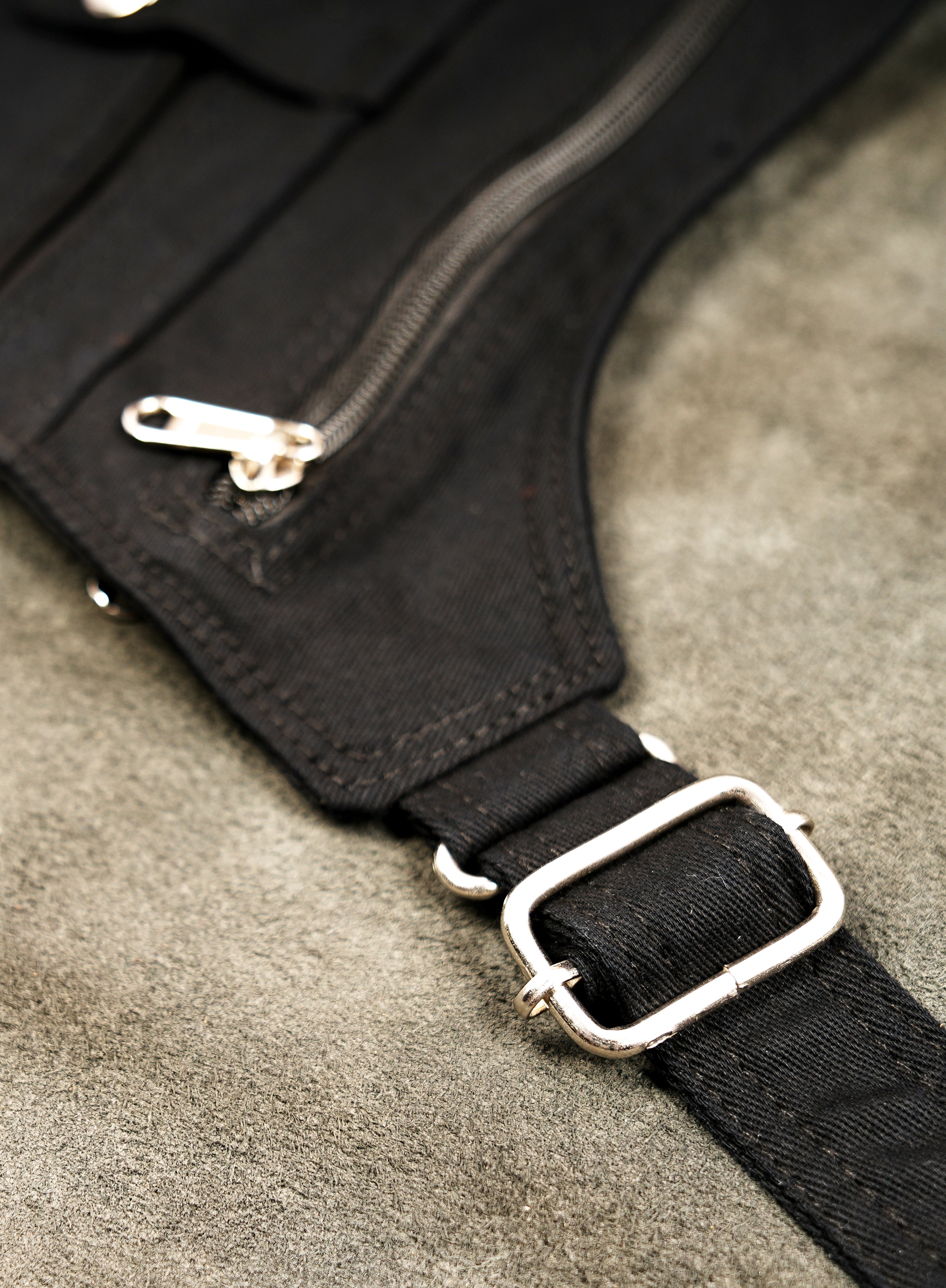 Rugged canvas chest harness showcasing double pockets and snap closures