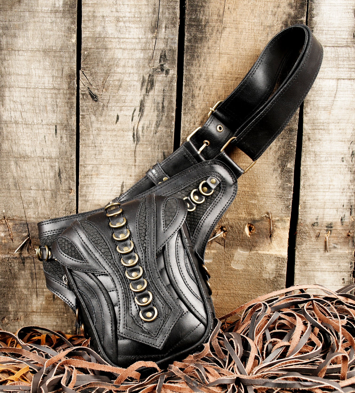 Festival black leather belt bag with embossed design
