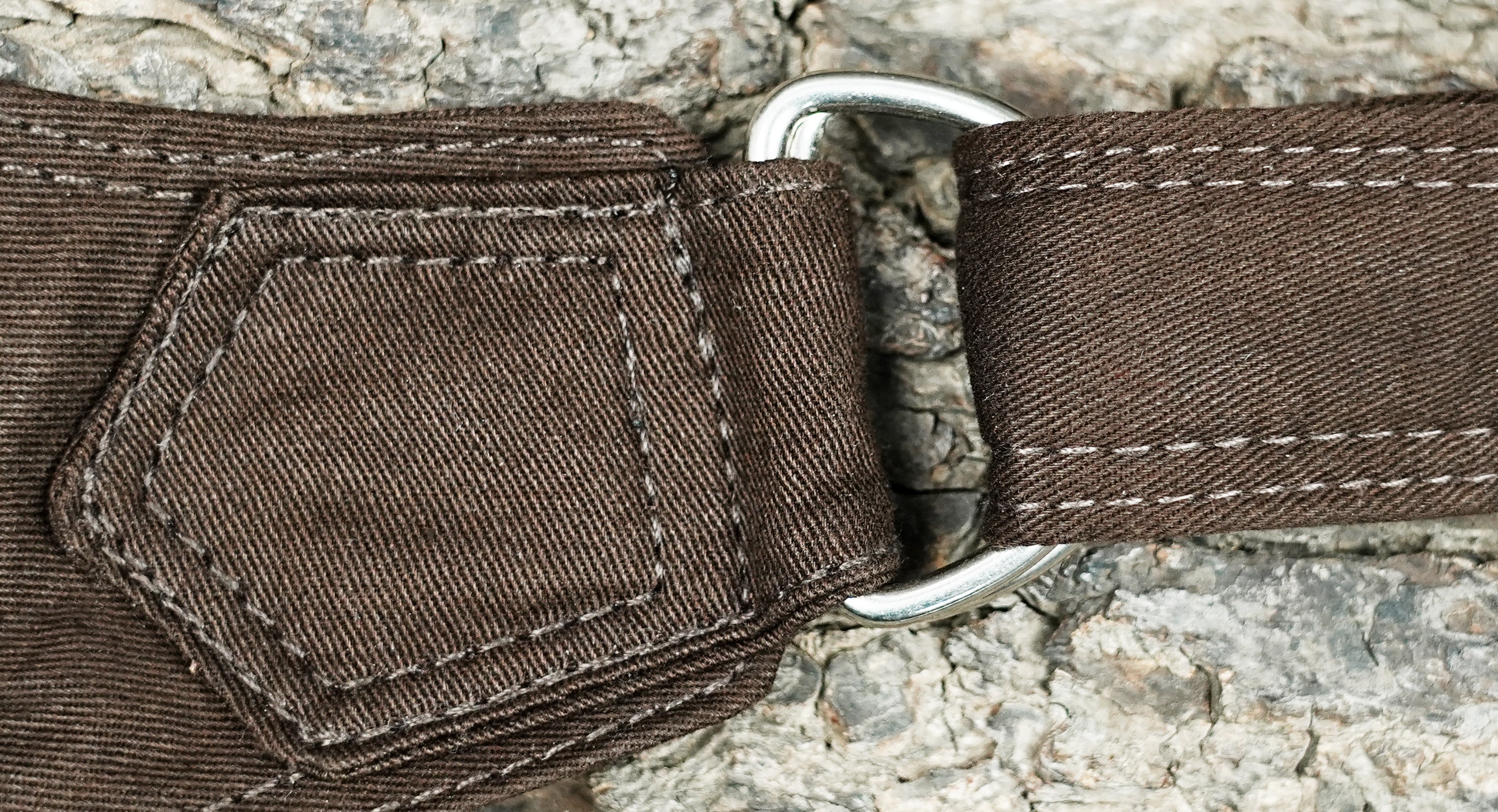 Rugged brown cotton thigh bag featuring metal hardware details