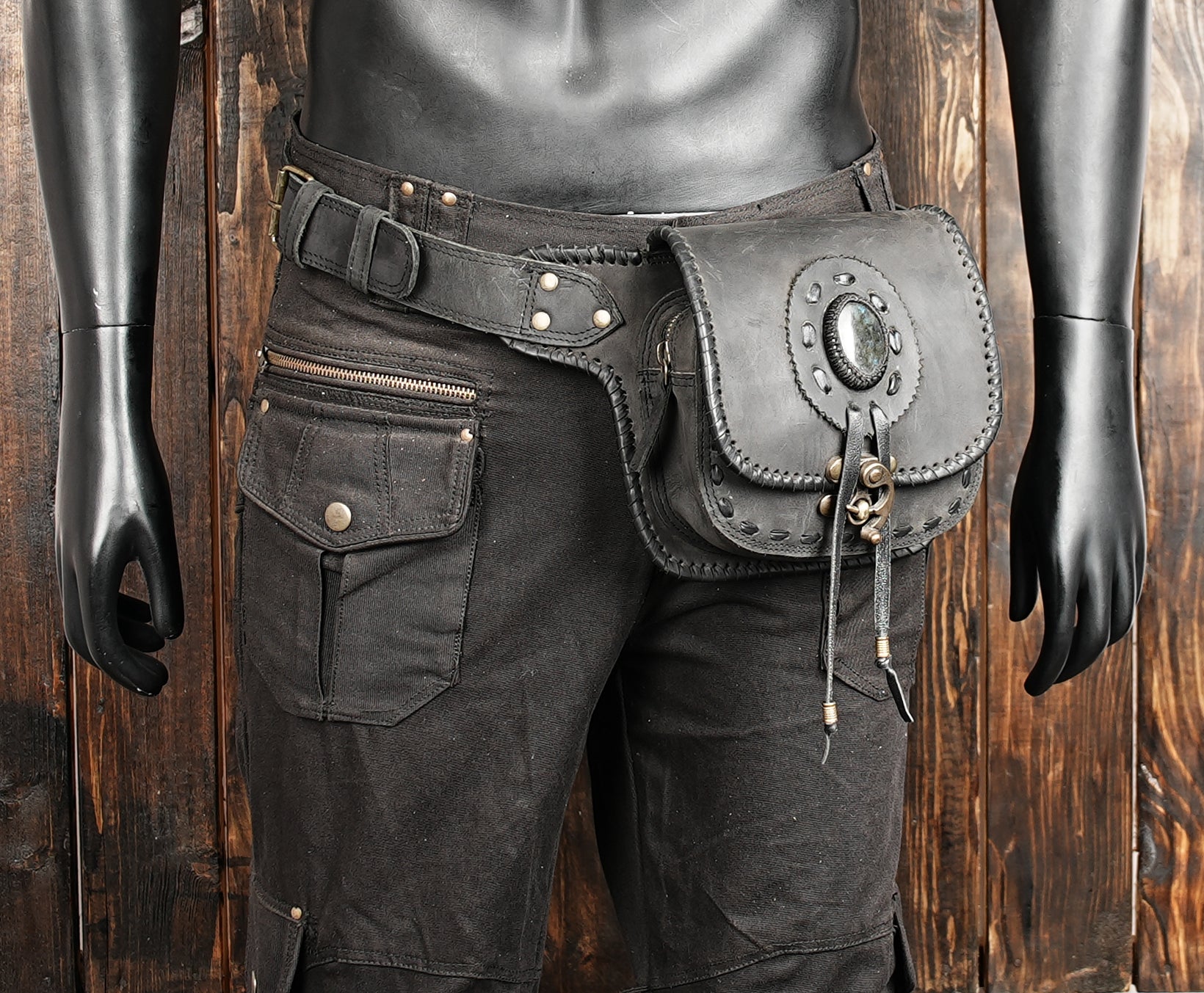 Black leather hip pouch styled on mannequin waist