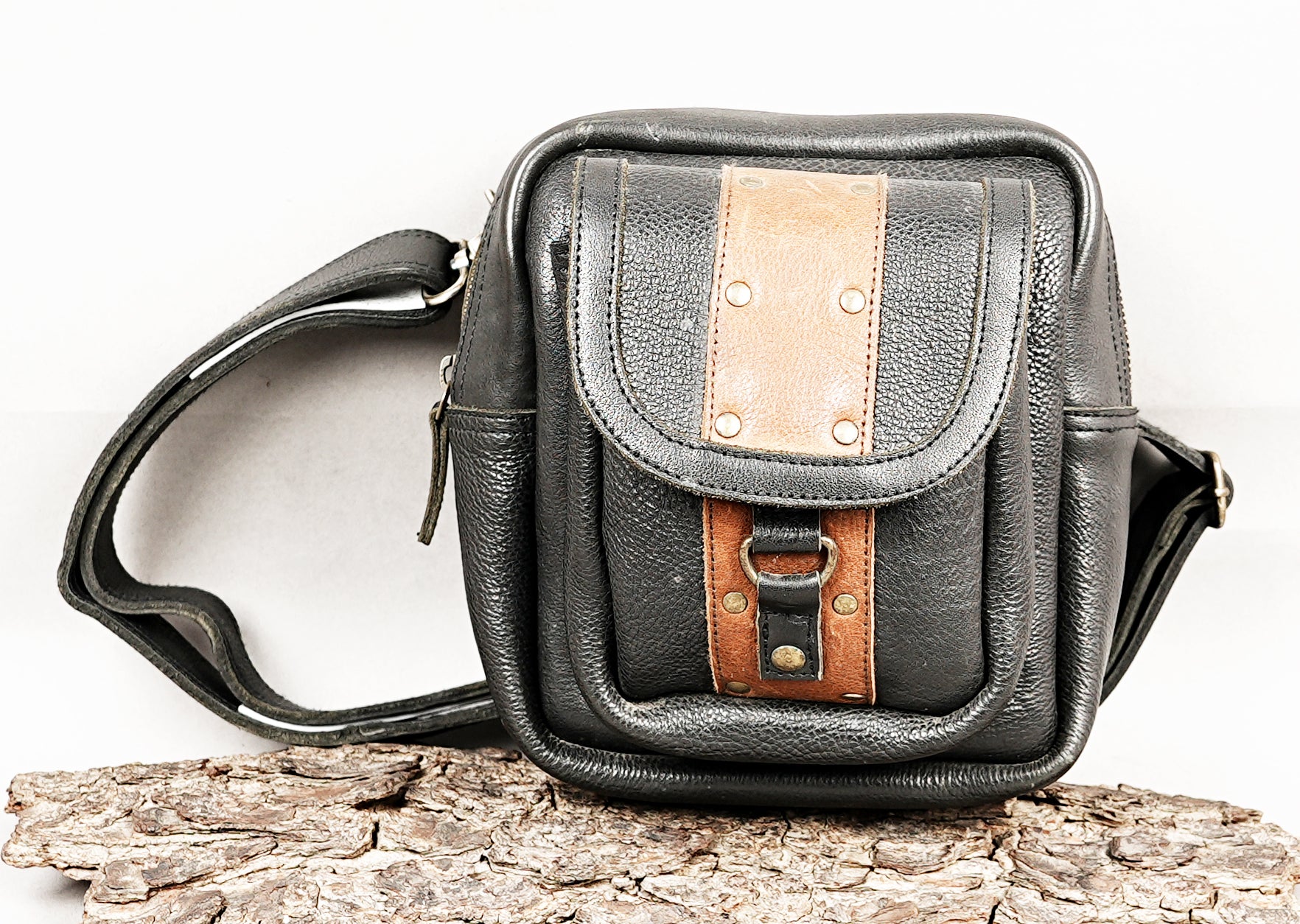 Premium leather waist bag with front flap pocket and buckle detail