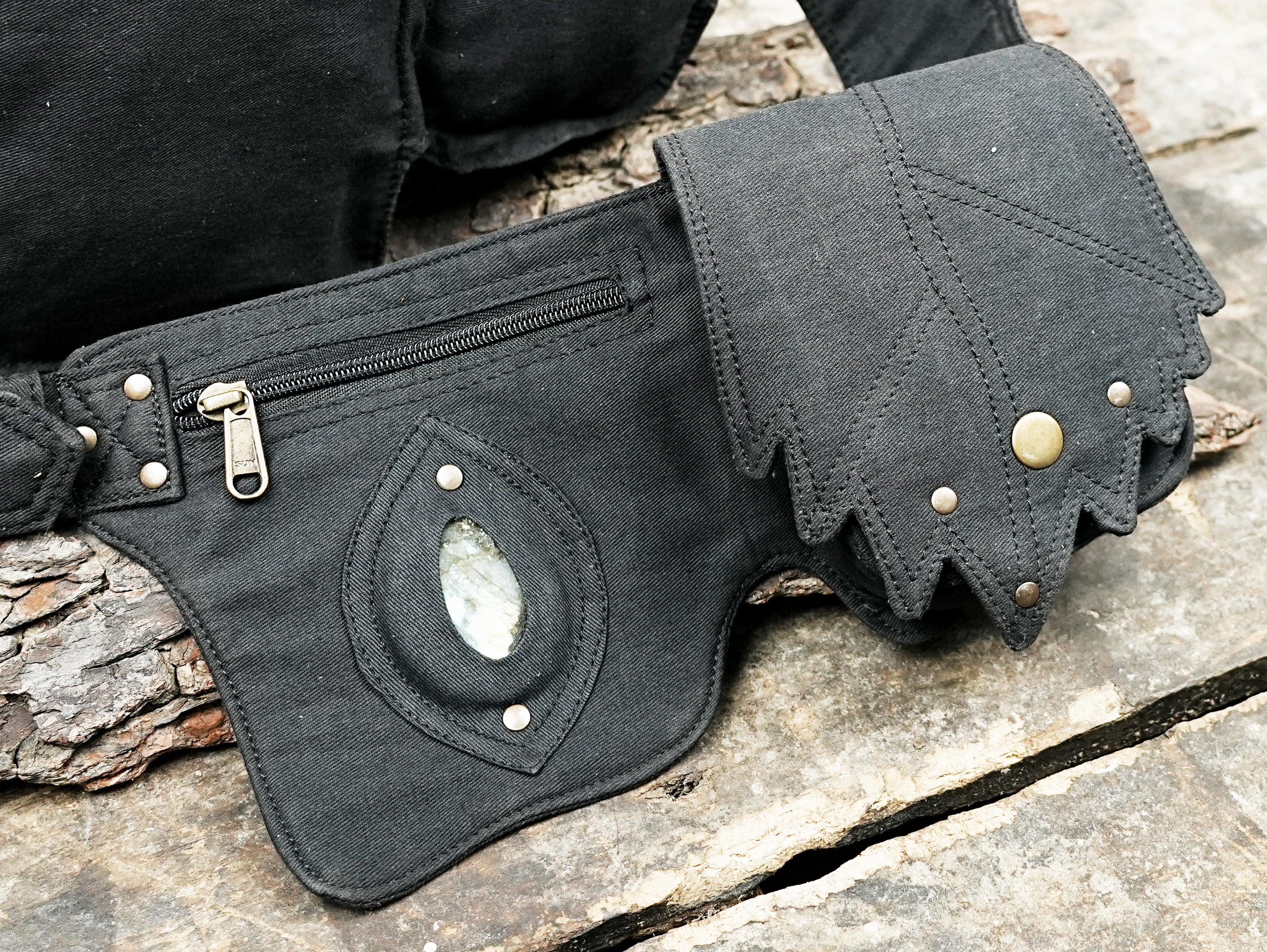 Travel bum bag in black fabric with secure zip and stone accent