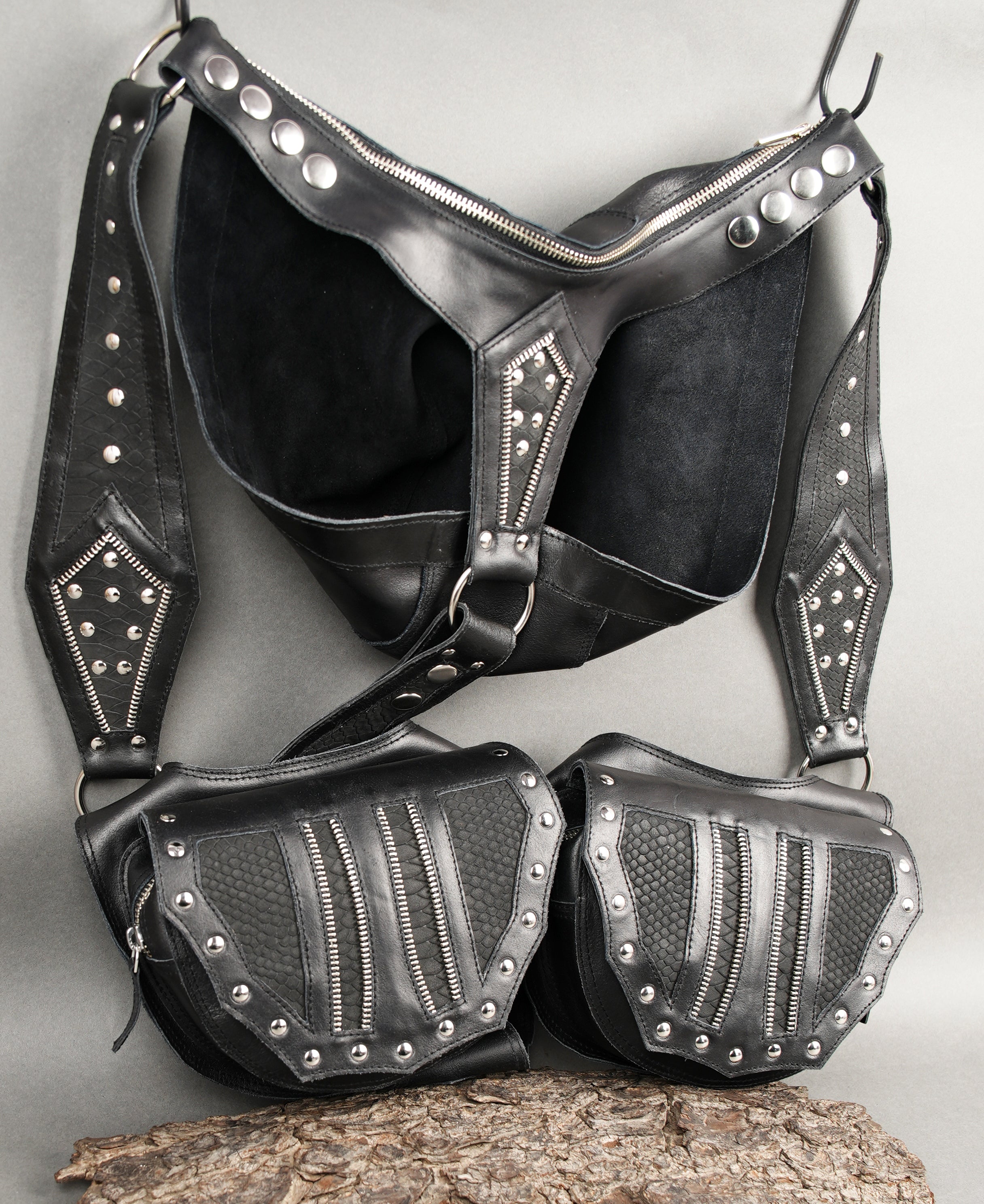 Black harness holster with secure snap and buckle straps