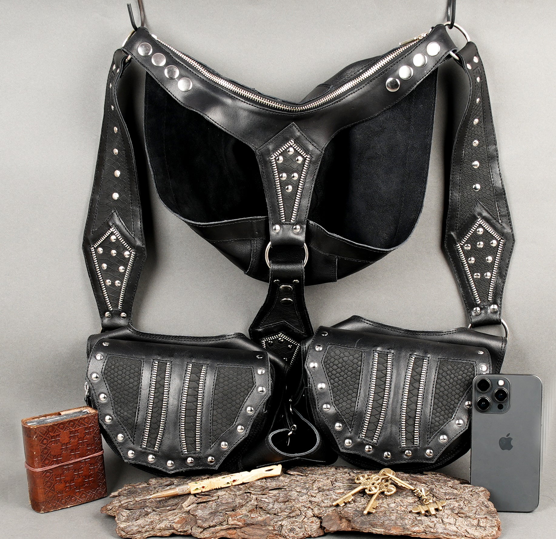Gothic style leather holster with riveted panels