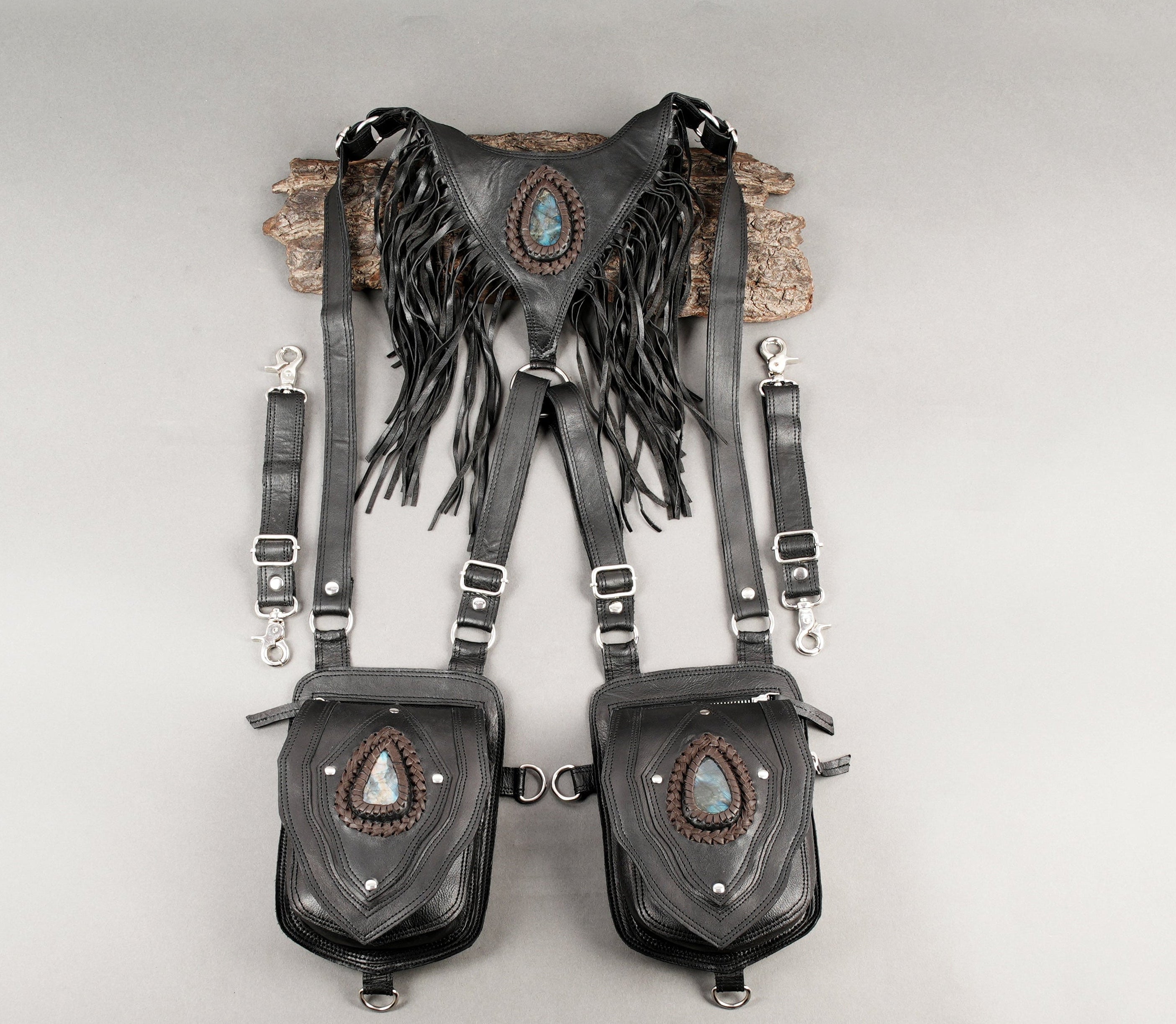 Black leather dual shoulder holster with gemstone accents and fringe