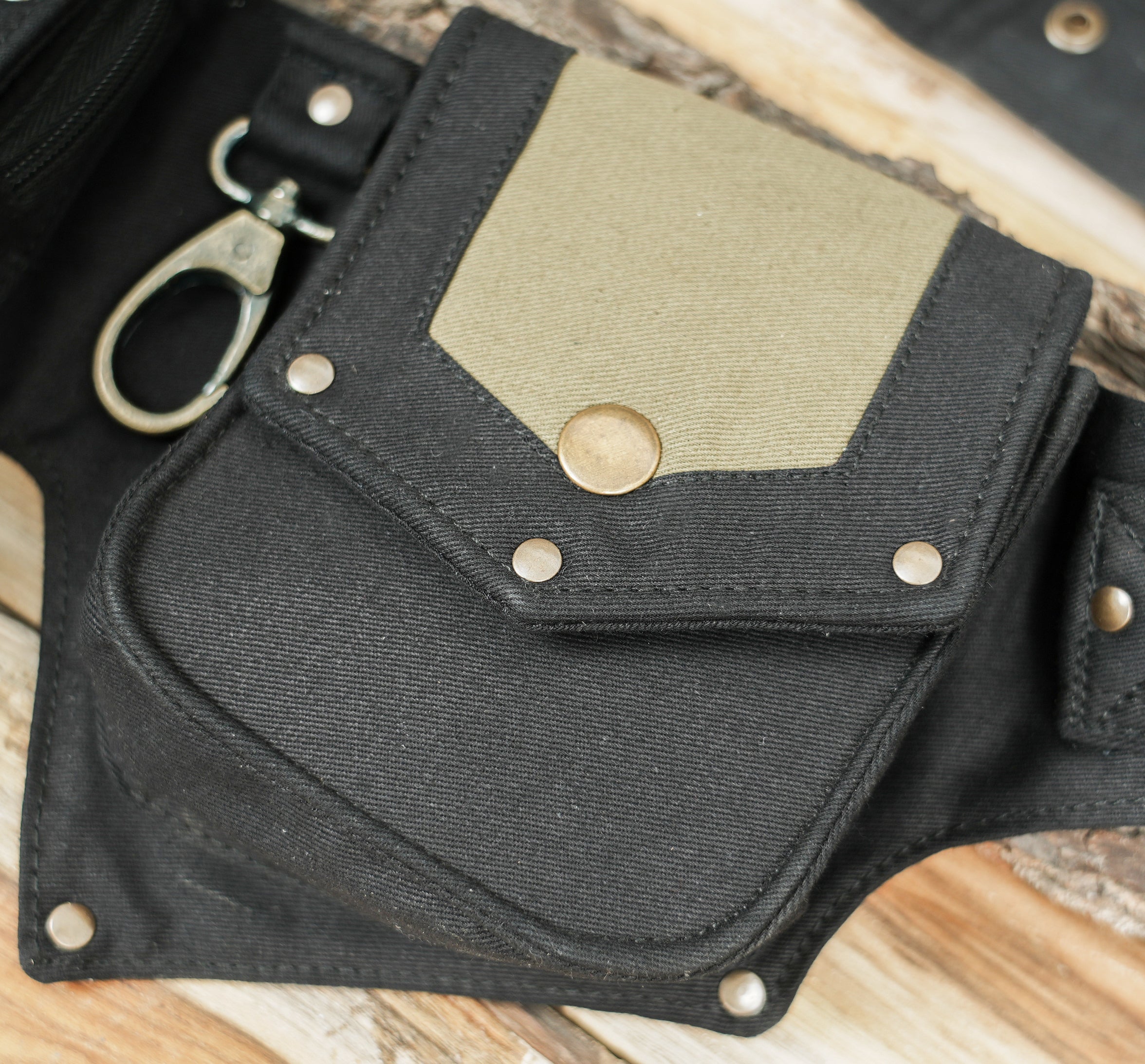 Four pocket canvas waist belt with olive tan contrast insets and lace-up details