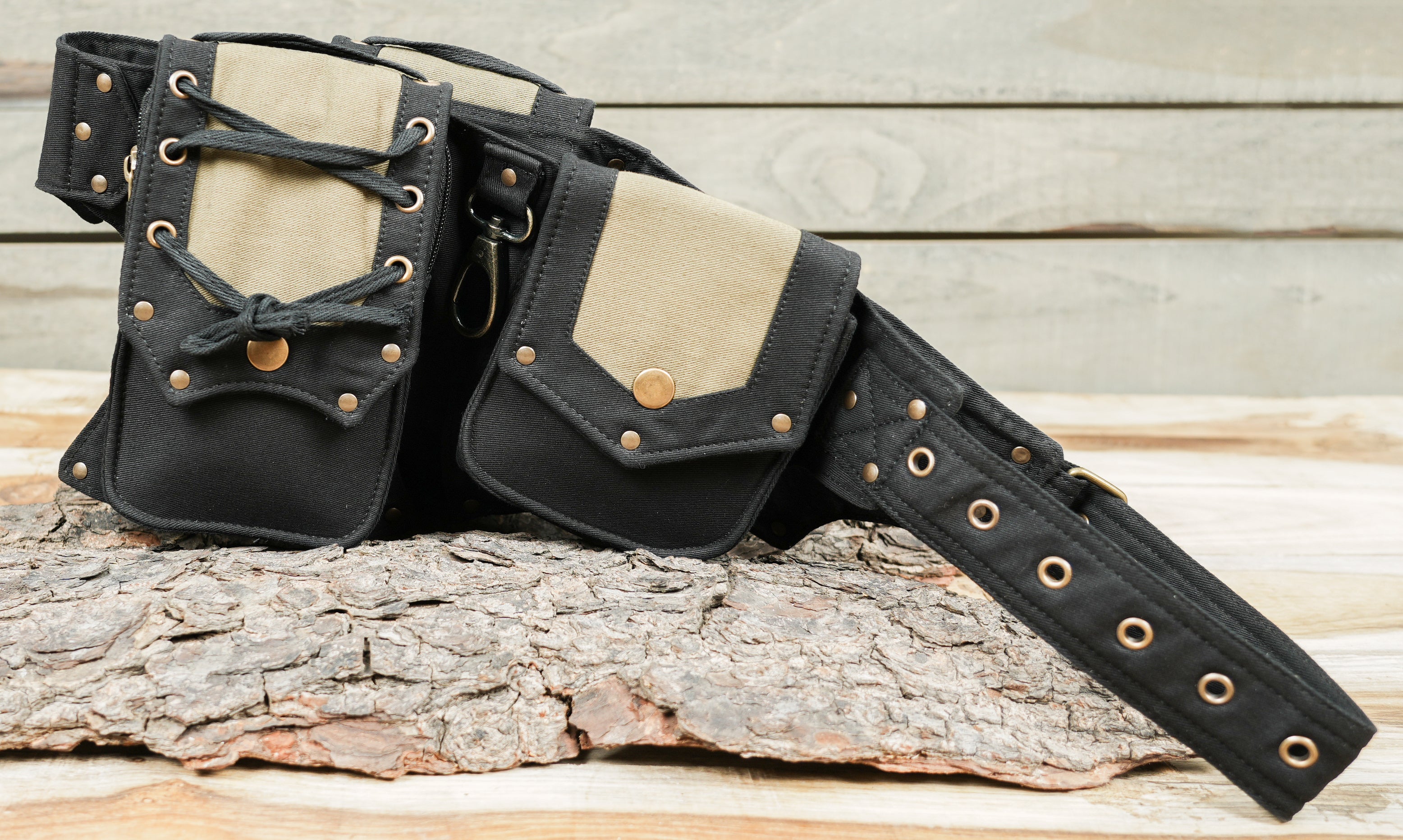 Alternative rave waist pack with four compartments and brass ring attachments