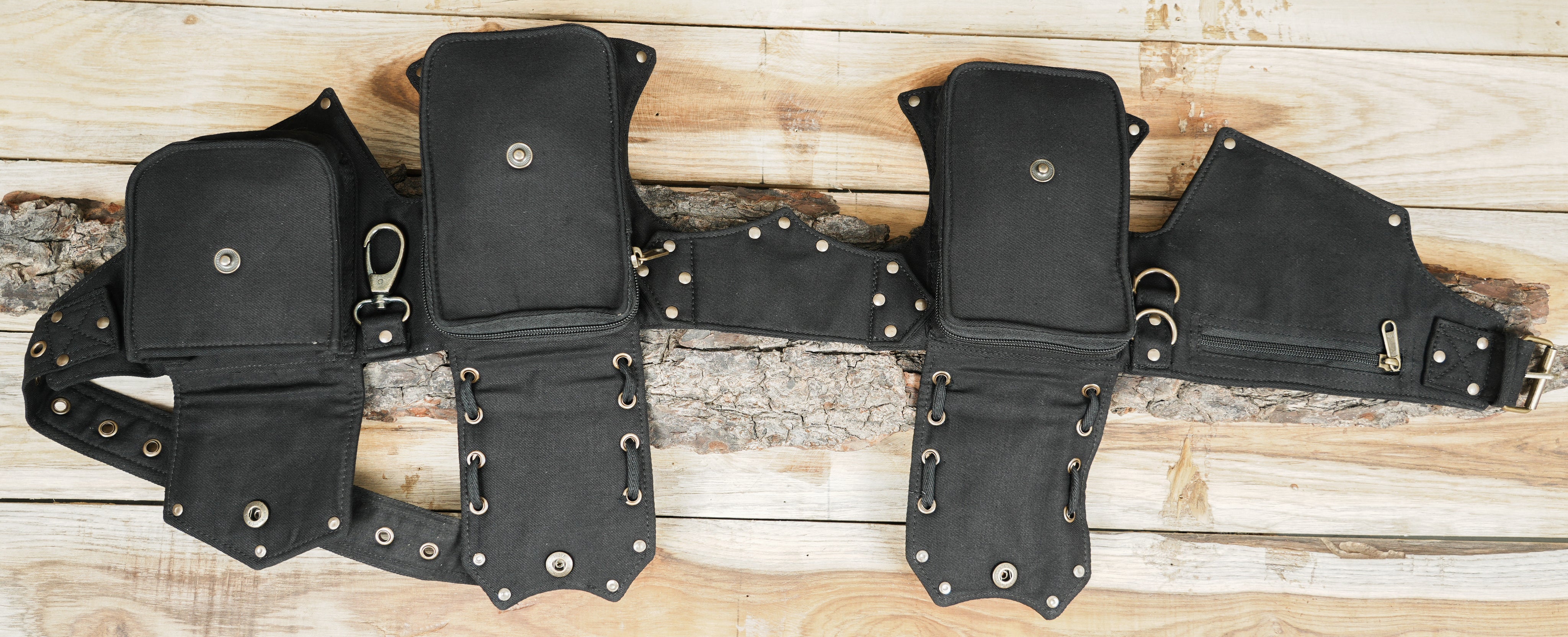 Multi compartment festival fanny pack with brass zippers and snap closures