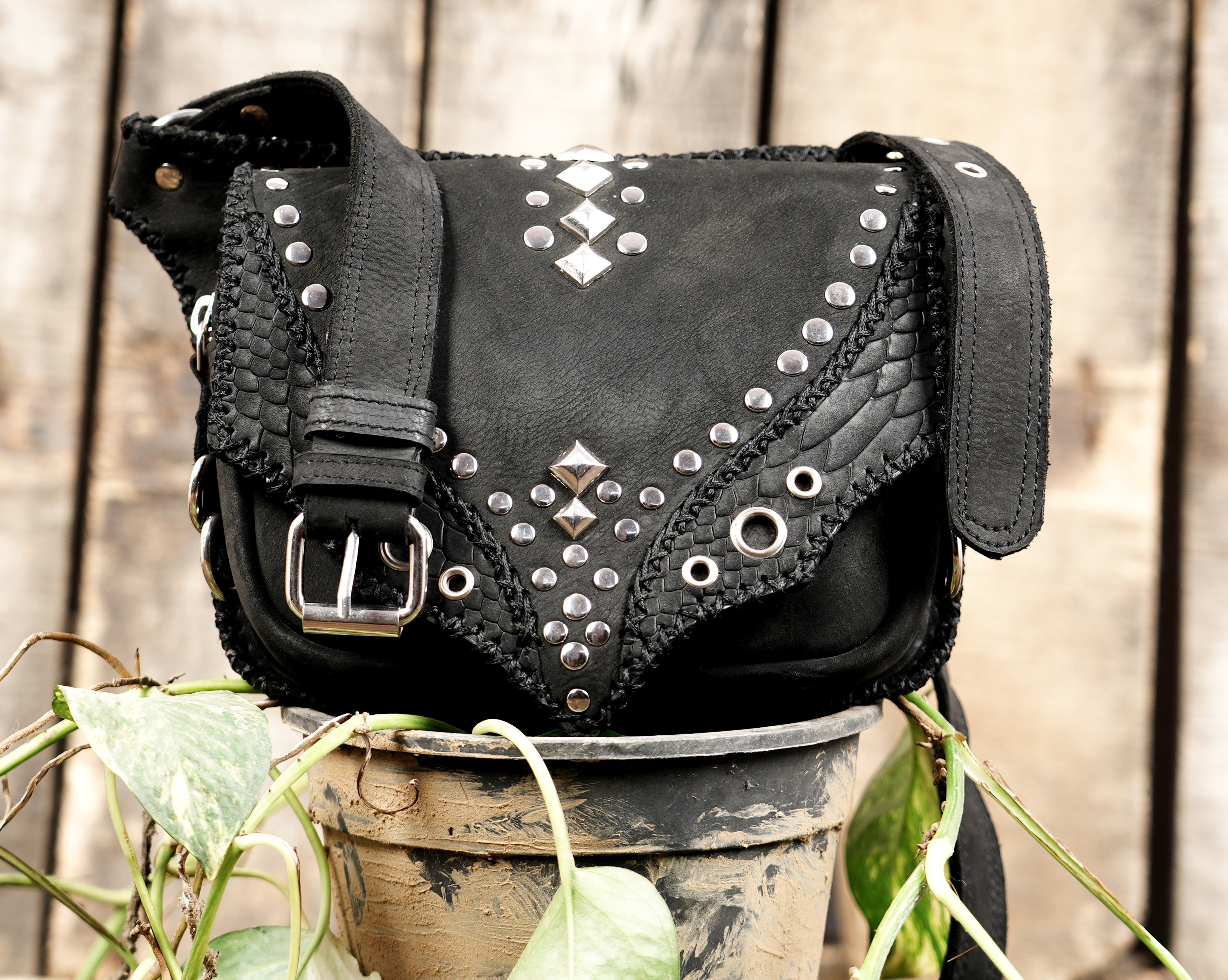 Black leather fanny bag with textured front panel