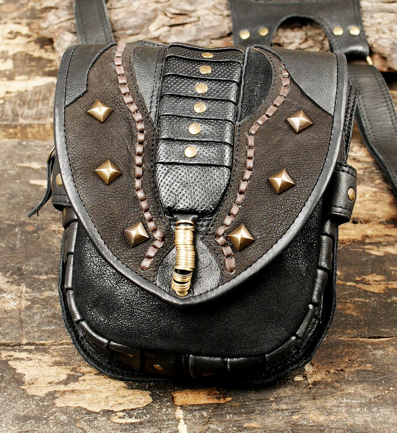 Boho style leather harness bag with studded pockets