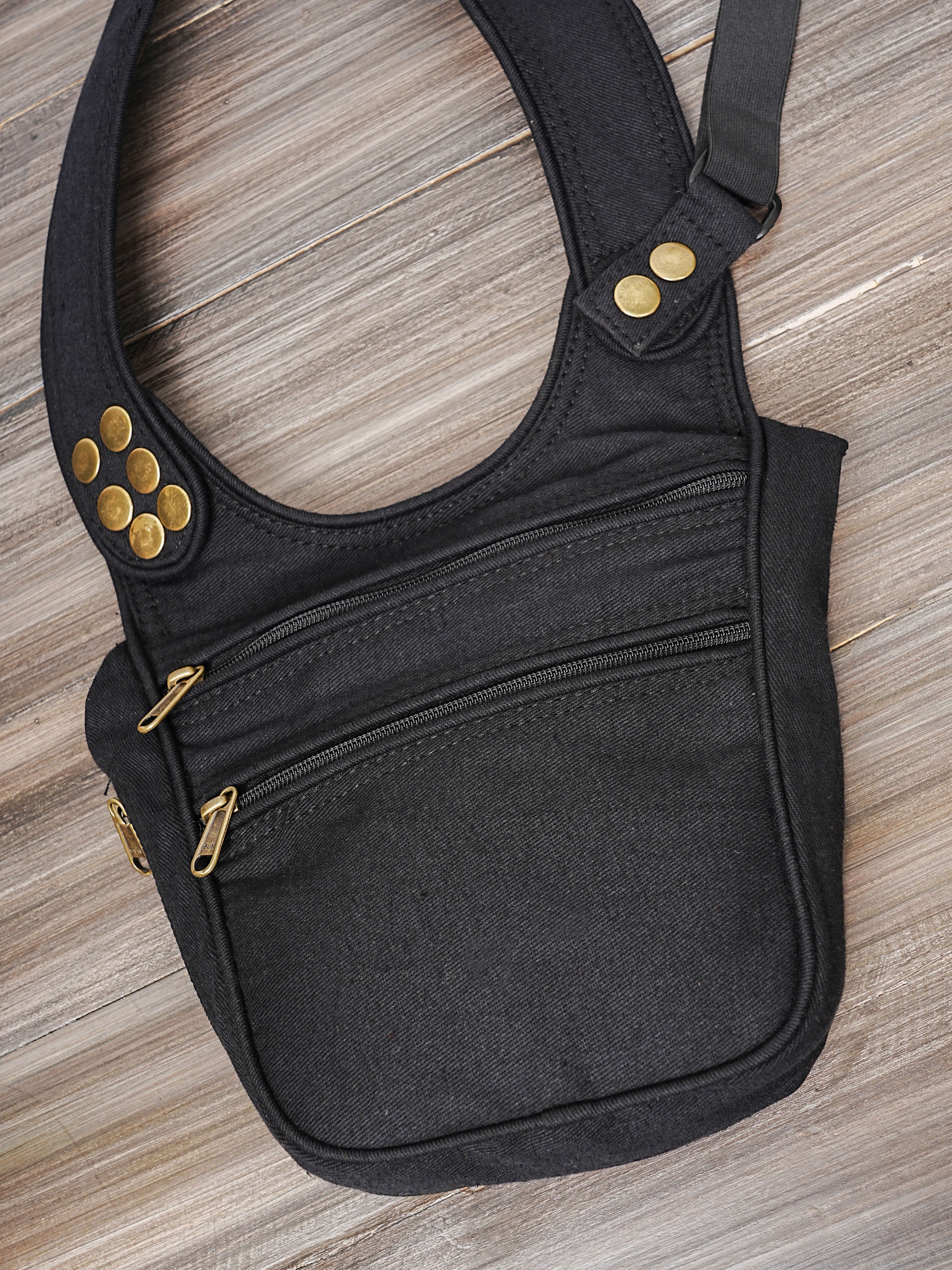Steampunk style black canvas body harness with brass button accents