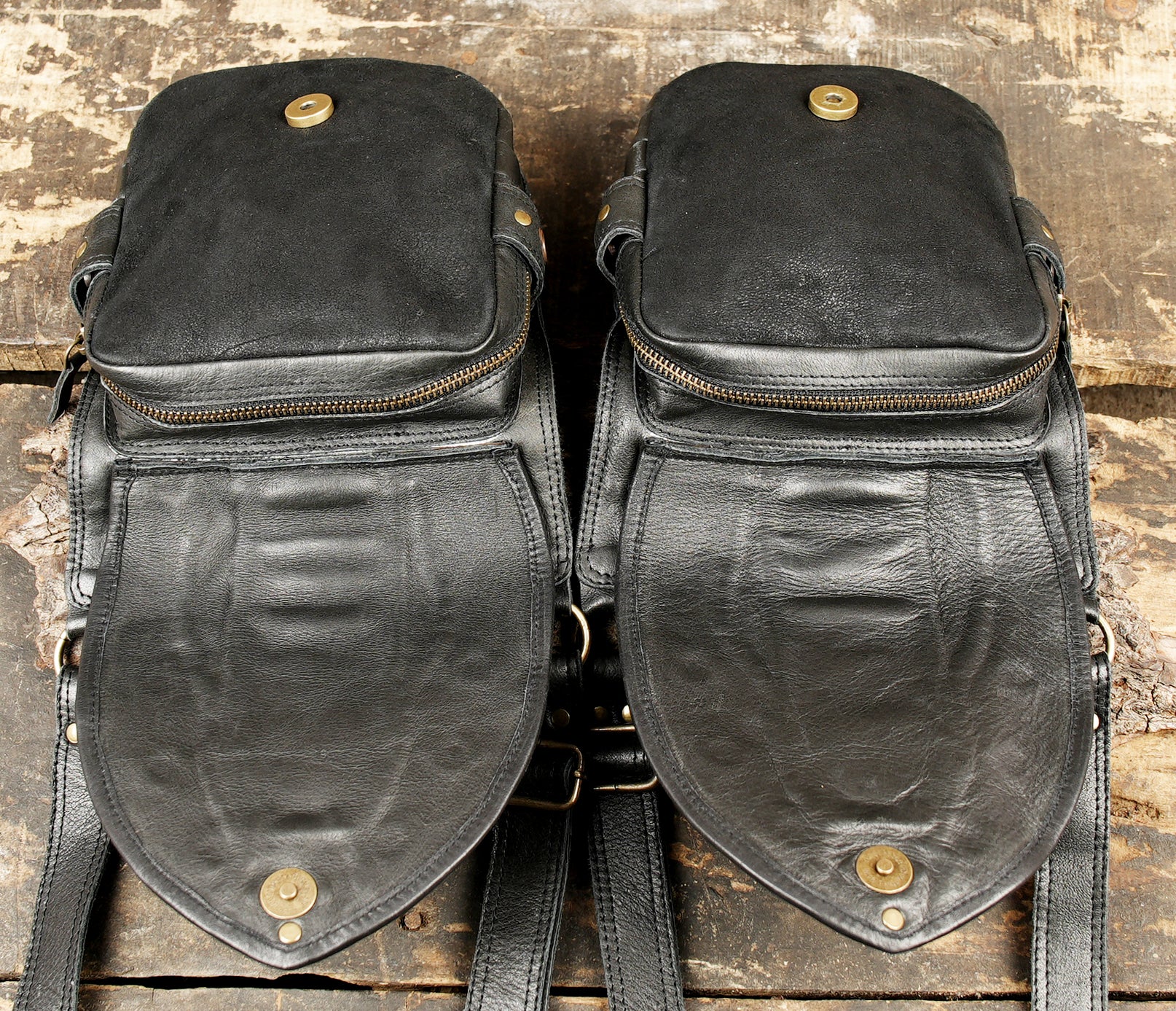 Rustic leather holster with metal studs and clips