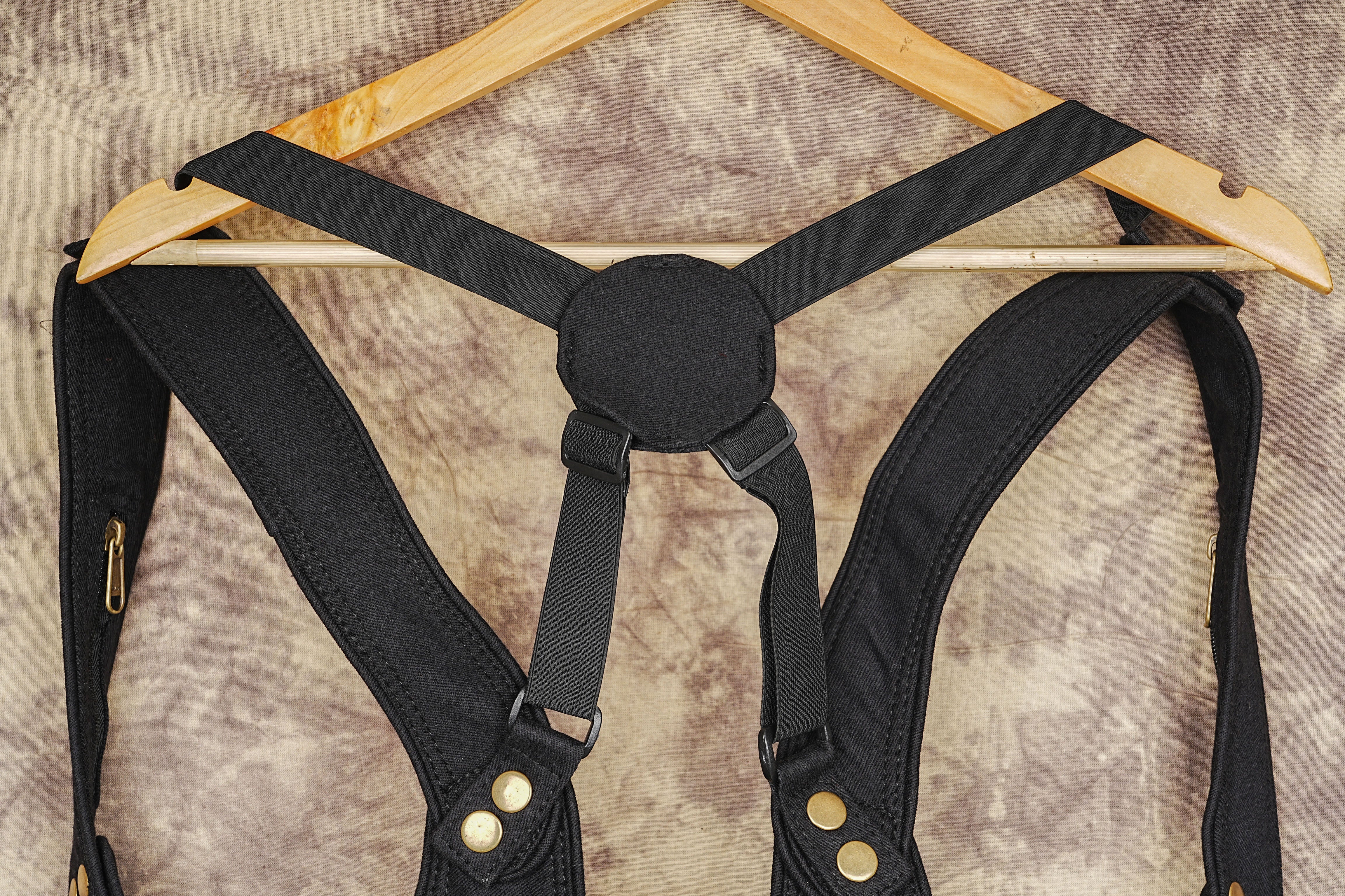 Unisex black canvas shoulder holster bag with brass hardware details