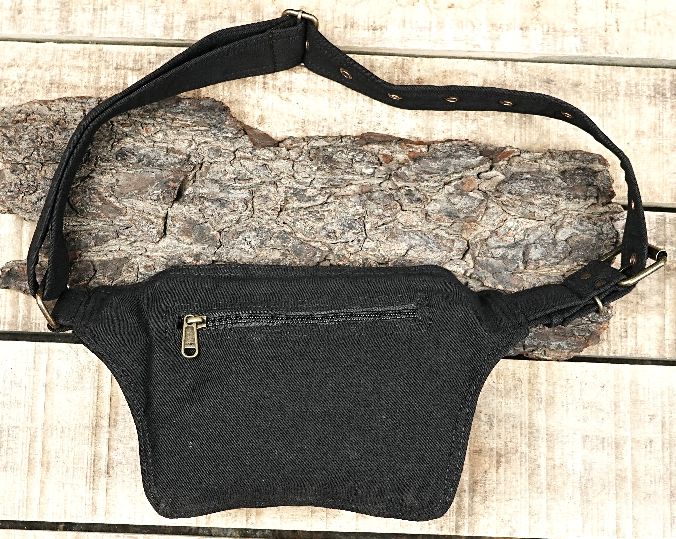 Bike messenger style utility belt with a single pouch and adjustable strap.