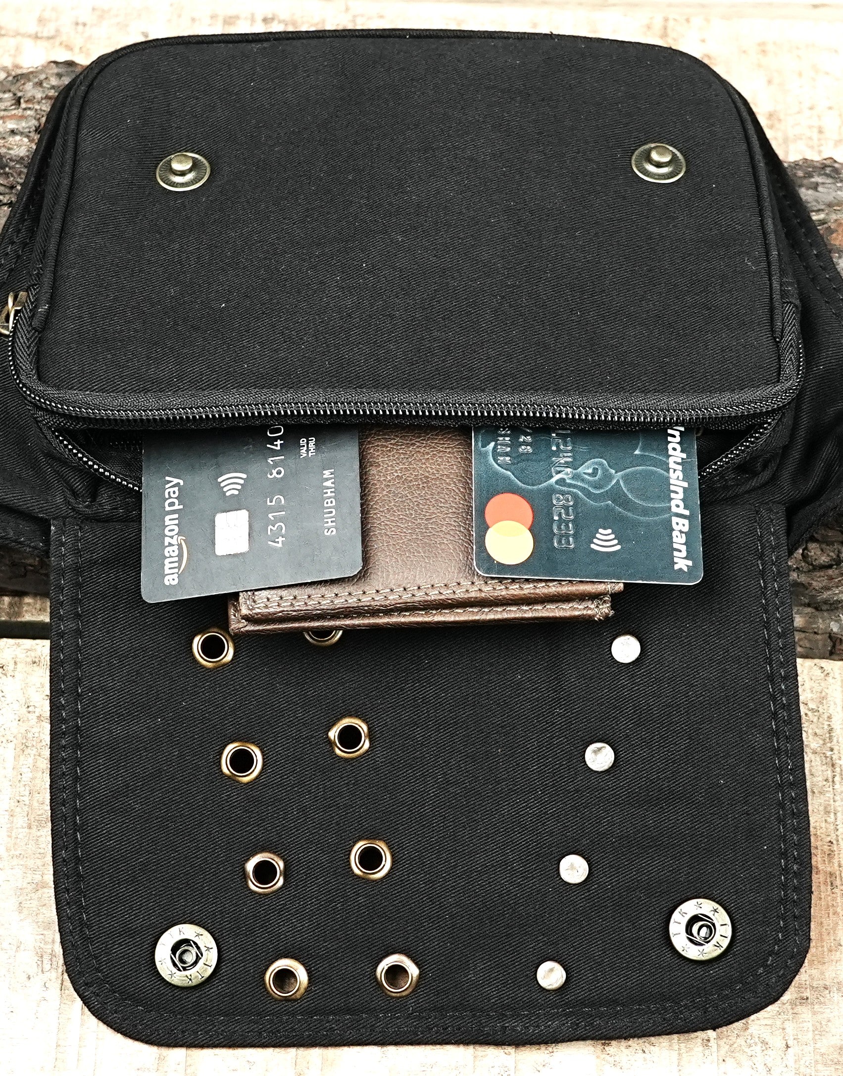 Boho-chic festival belt bag with a pocket and metallic stud details.