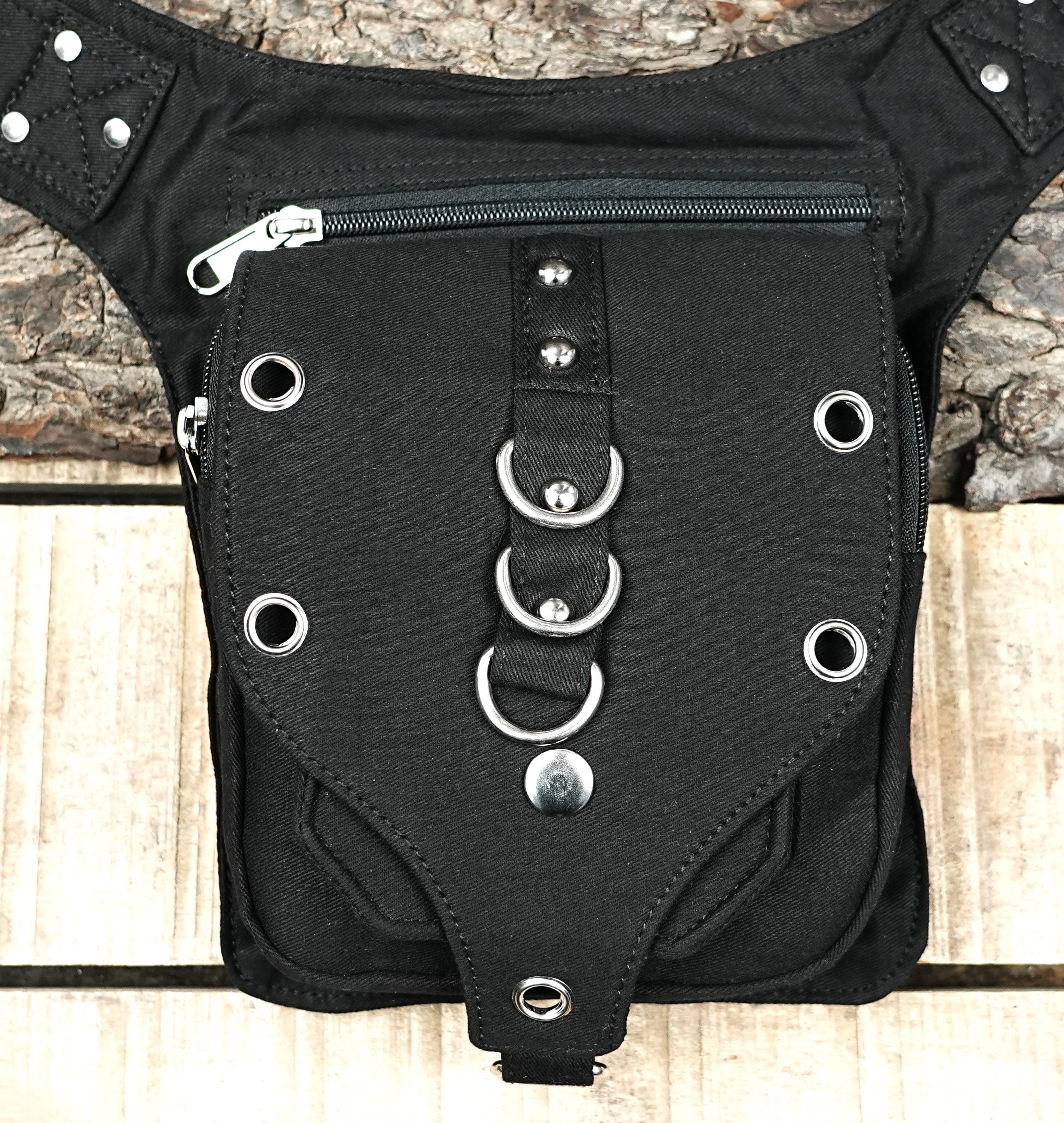 "An edgy, black goth-style leg bag with multiple zippered pockets, metal eyelets, and O-rings, perfect for cyberpunk outfits." (USA/Europe)