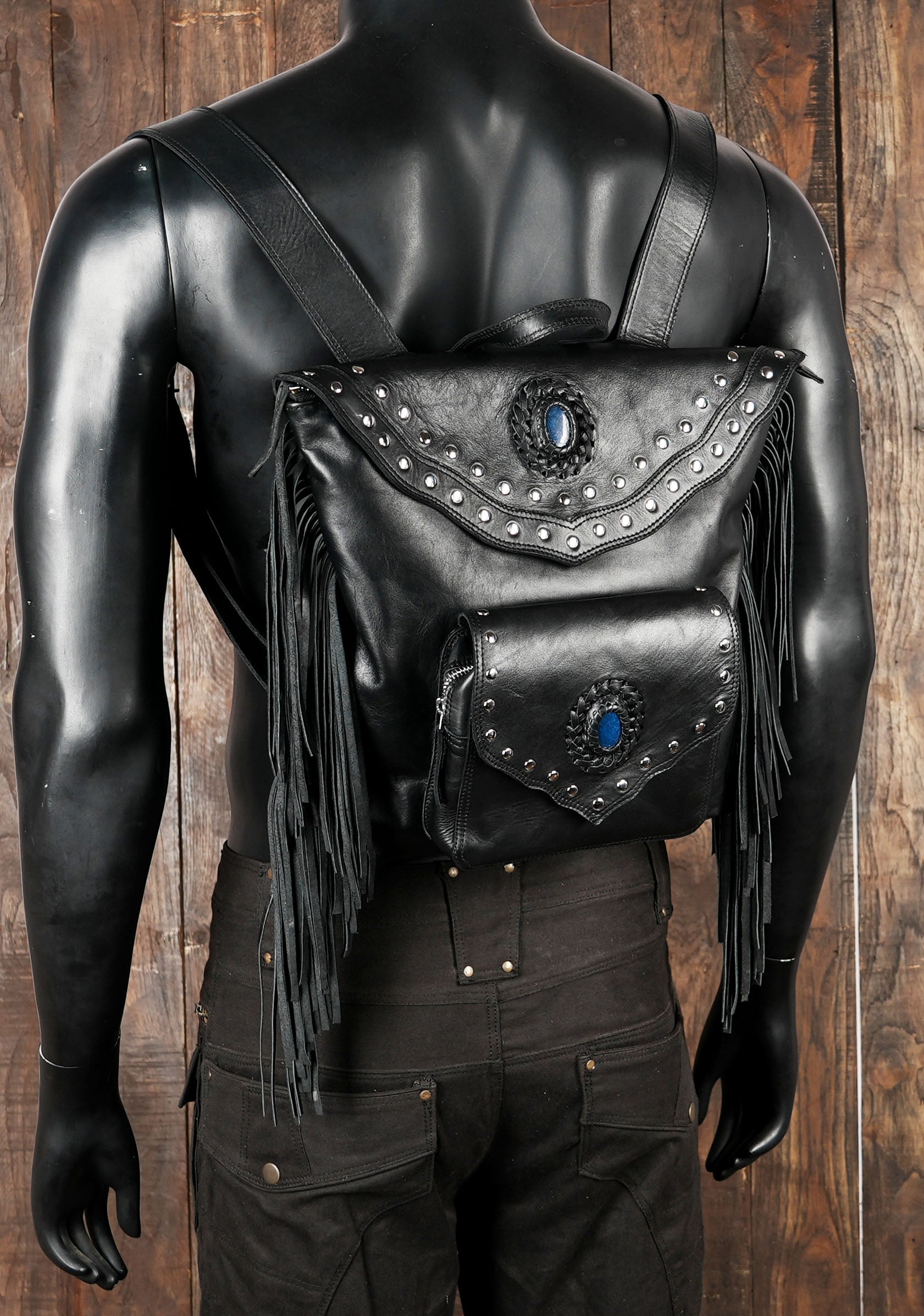 Black leather studded backpack styled for festivals and travel