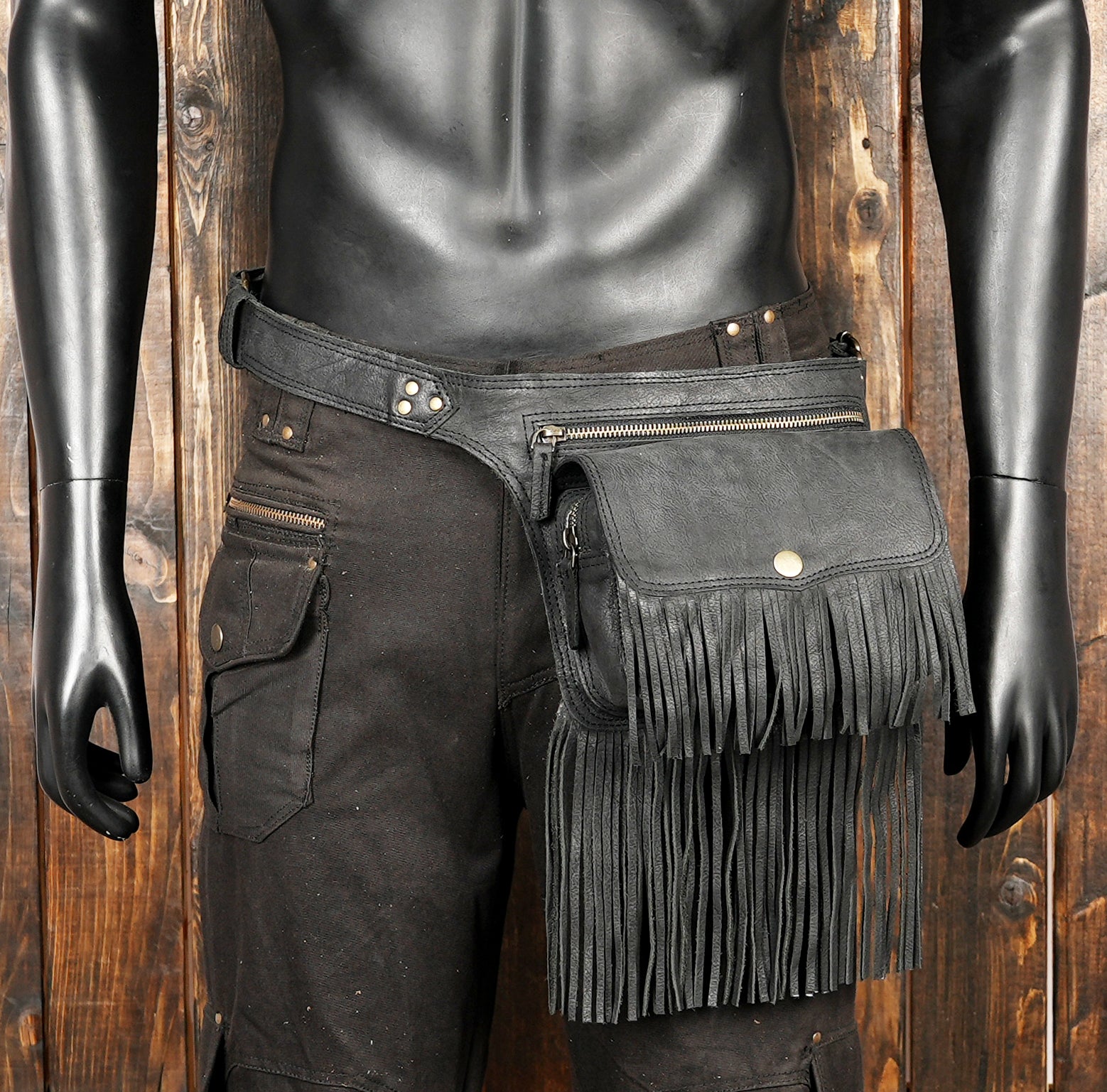 Trendy black waist pouch with fringe accents and vintage brass hardware
