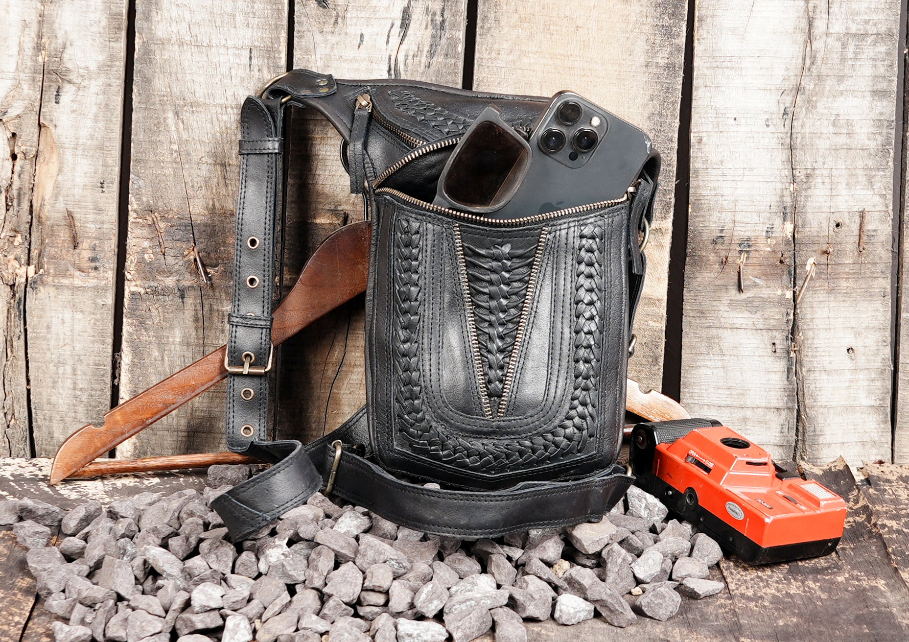 Durable leather thigh pouch with secure zip closure