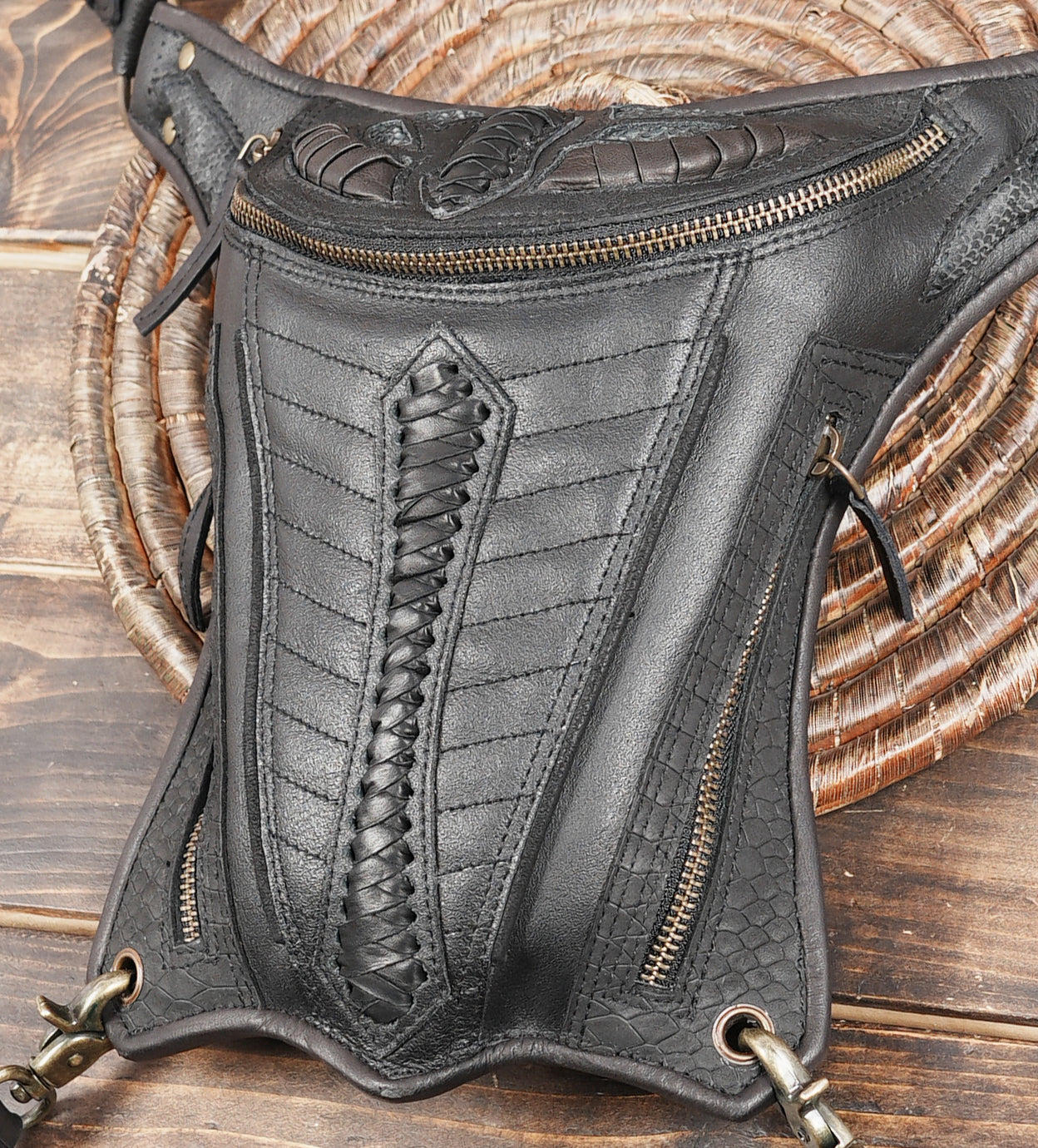 Detailed leather thigh pouch with embossed front
