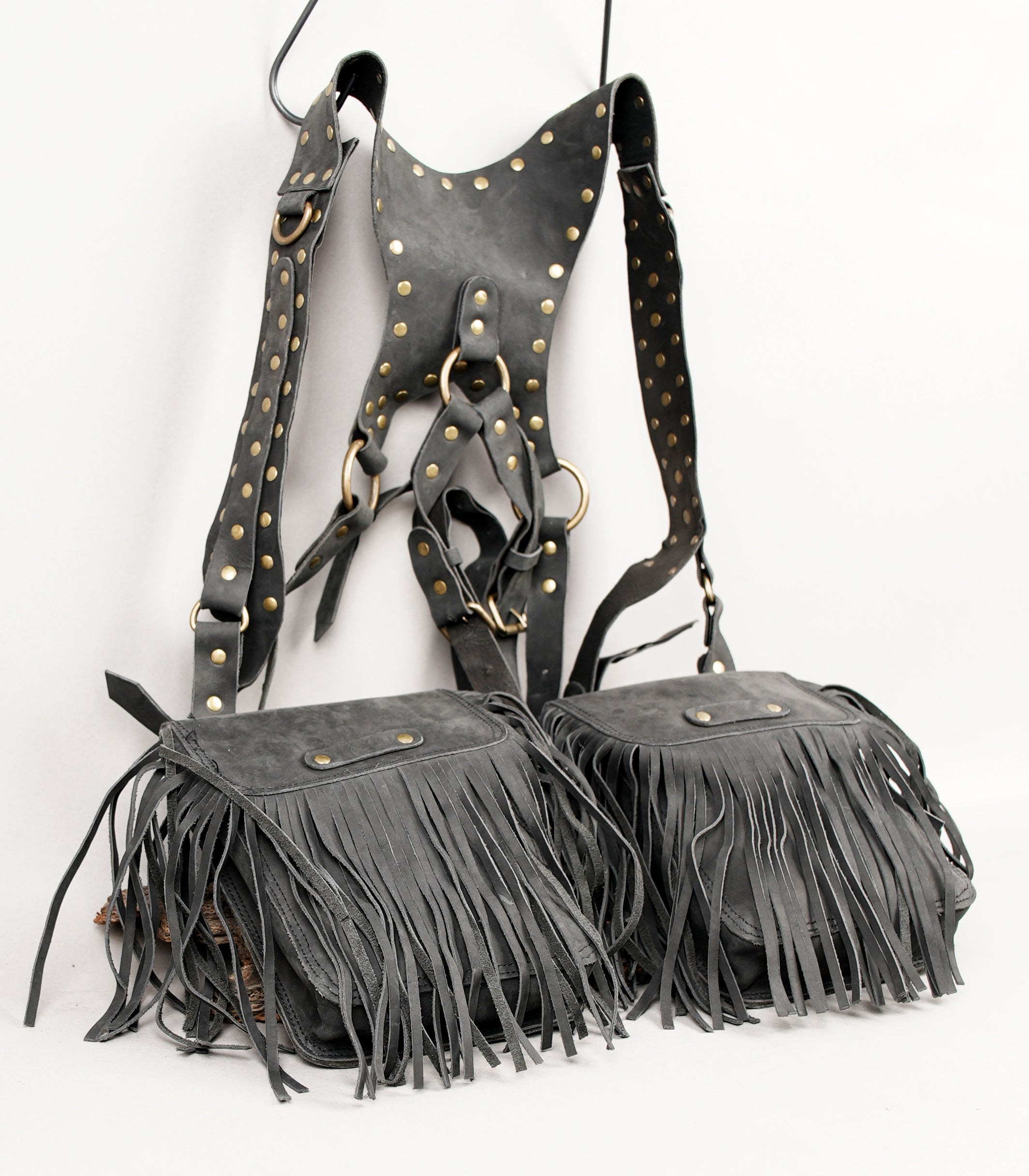 Artisan leather chest bag with fringe pockets