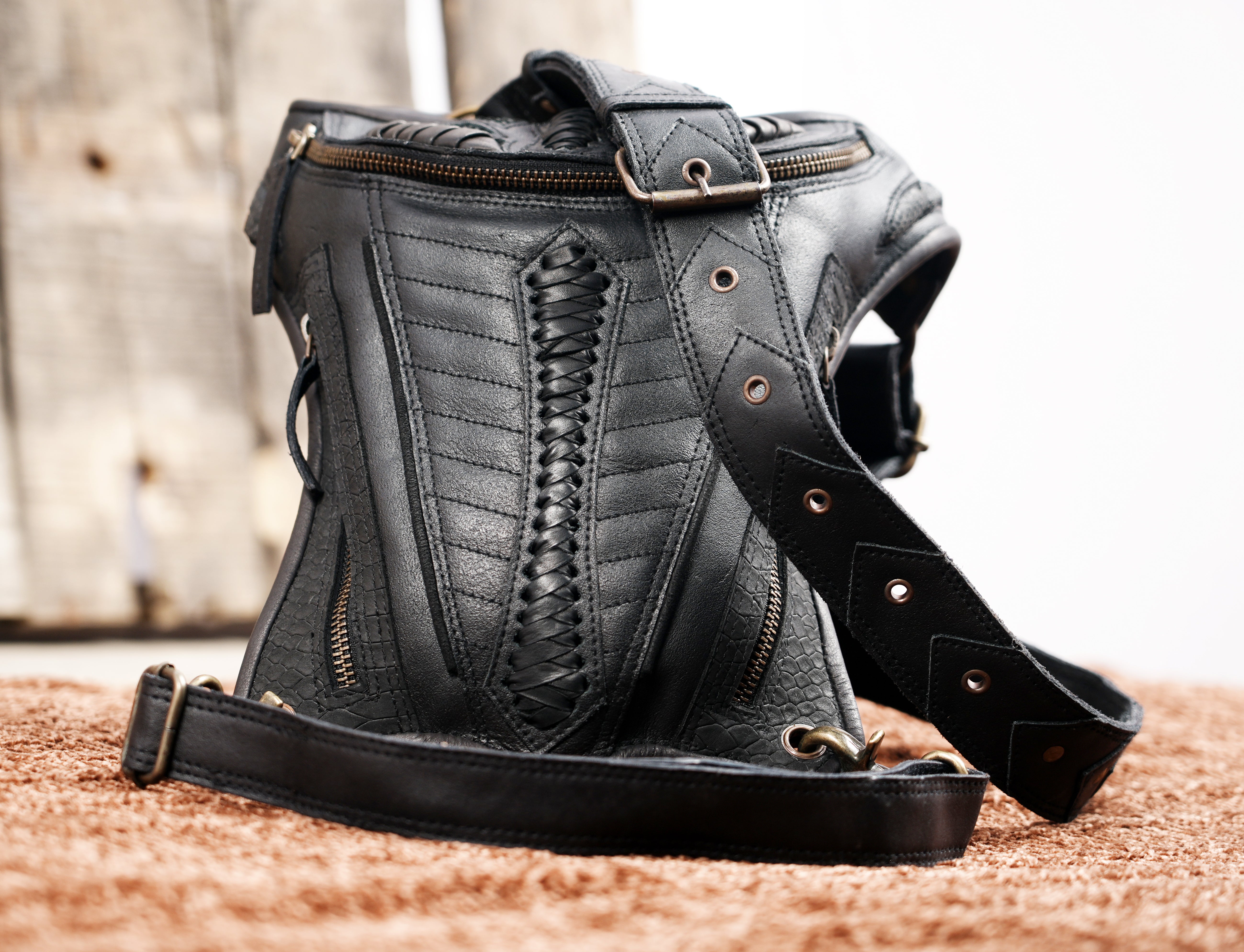 Rugged black leather utility holster with embossed detail