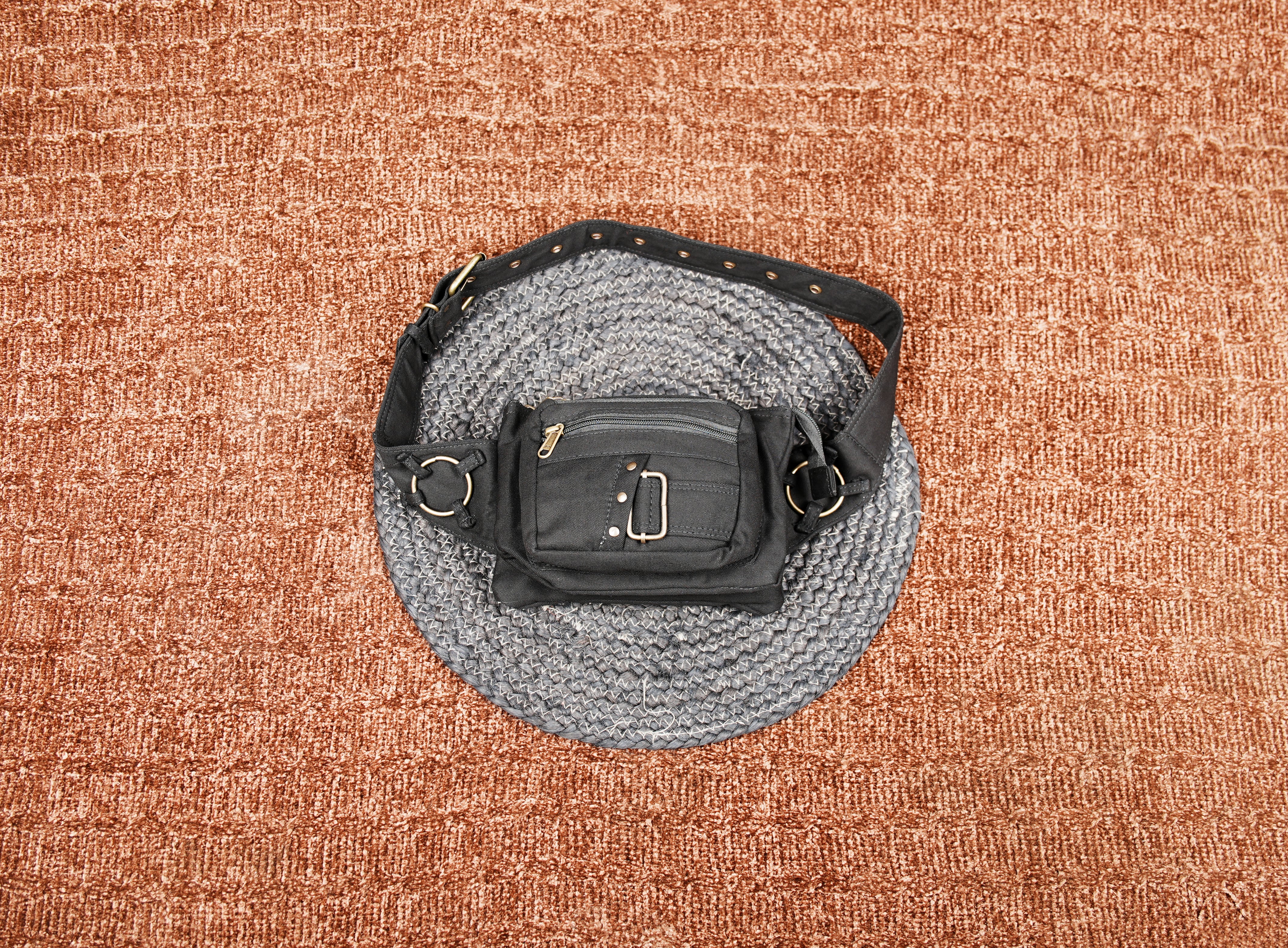 Black cotton waist belt bag with multiple zipper pockets and adjustable strap