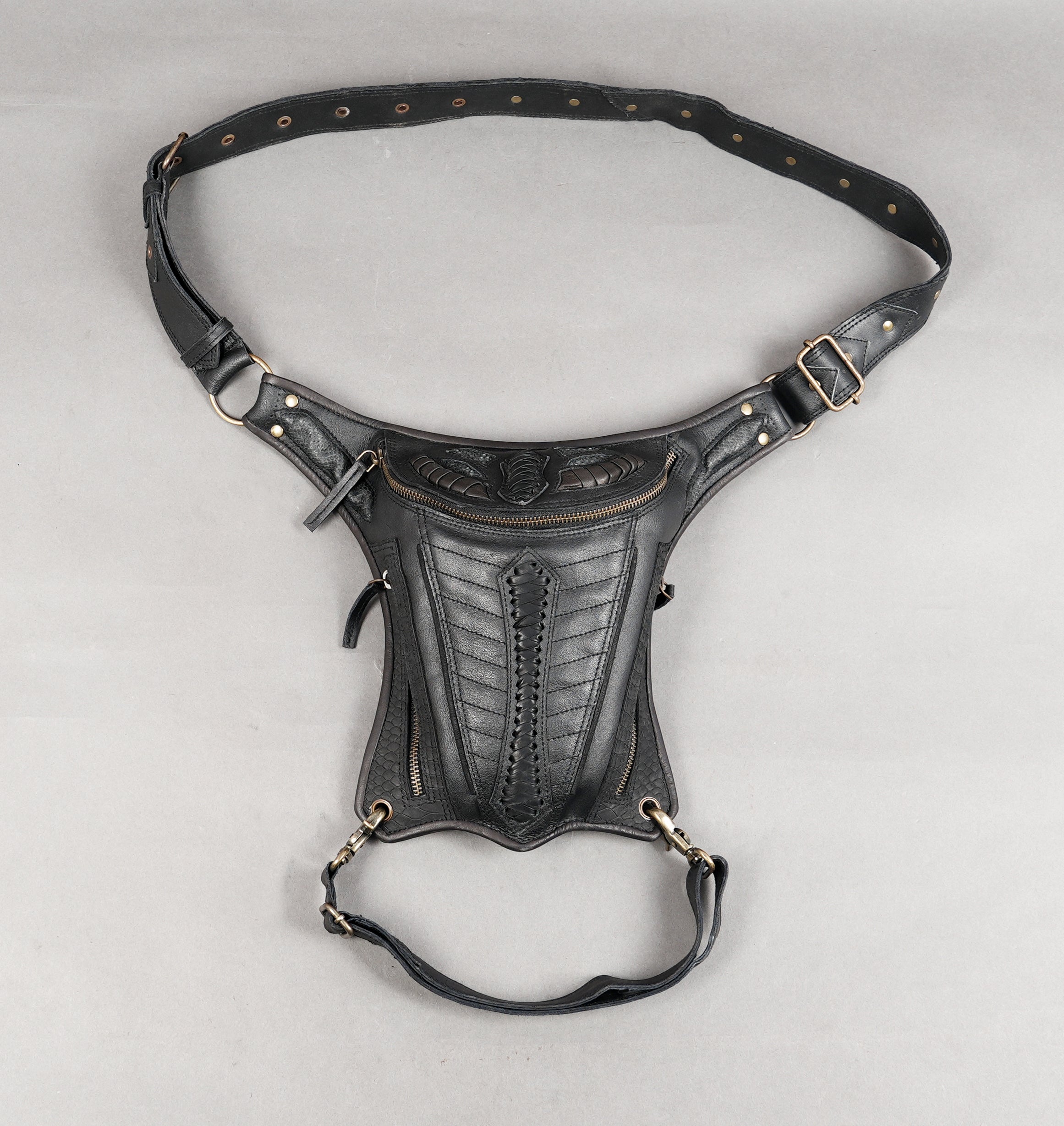 Handcrafted waist holster with sculpted geometric stitching