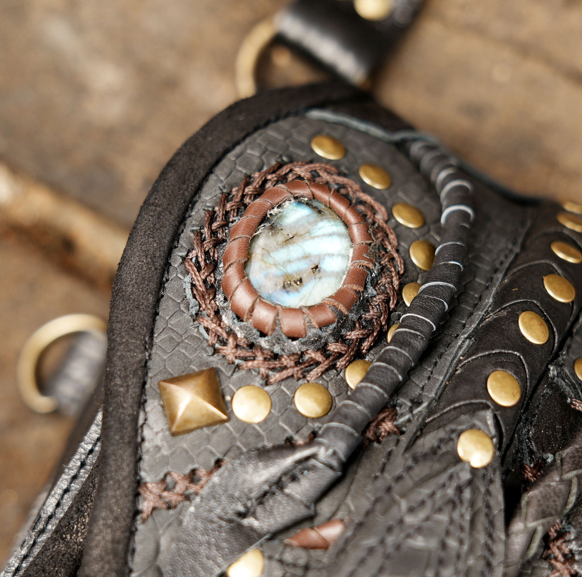 “Decorative leather holster harness with reptile pattern and braided tassels”