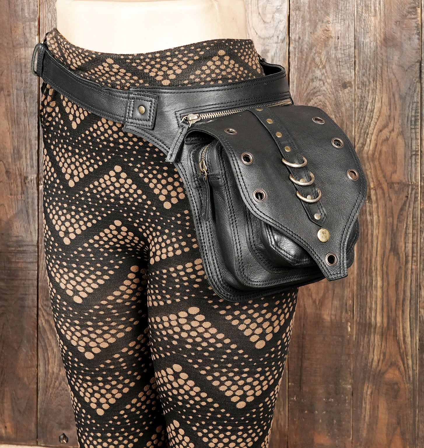 Edgy black leather waist bag with gothic punk design