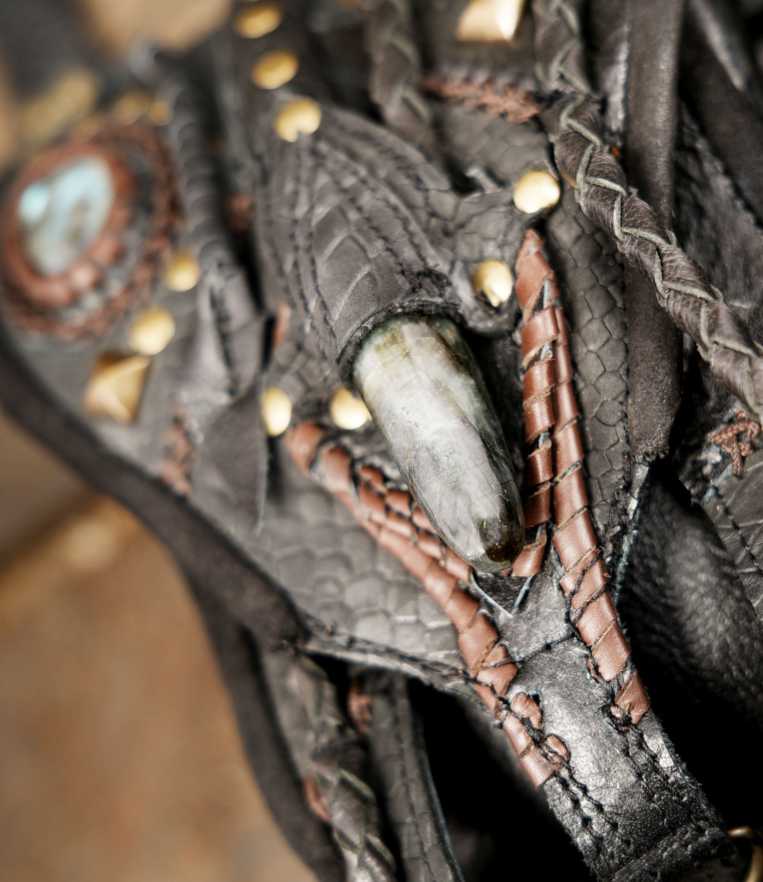 “Decorative leather holster harness with reptile pattern and braided tassels”