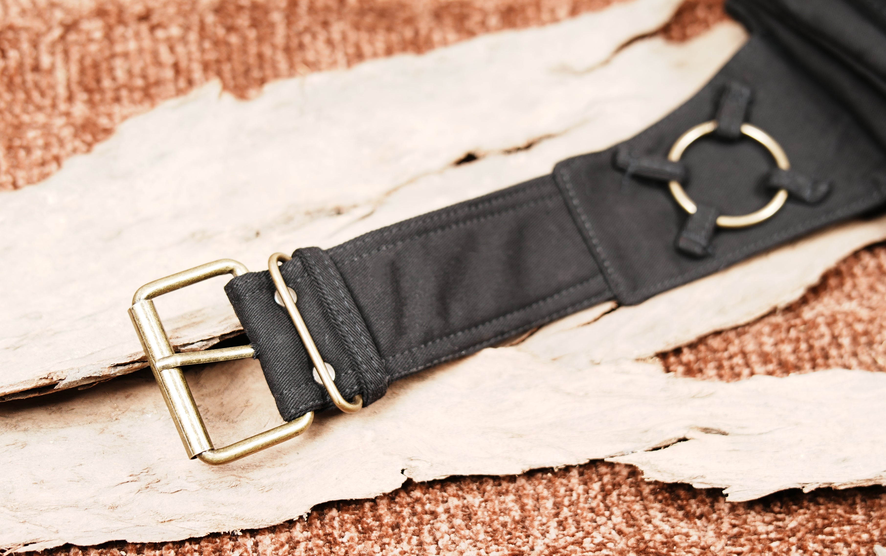 Black cotton fanny pack style belt bag with multiple compartments