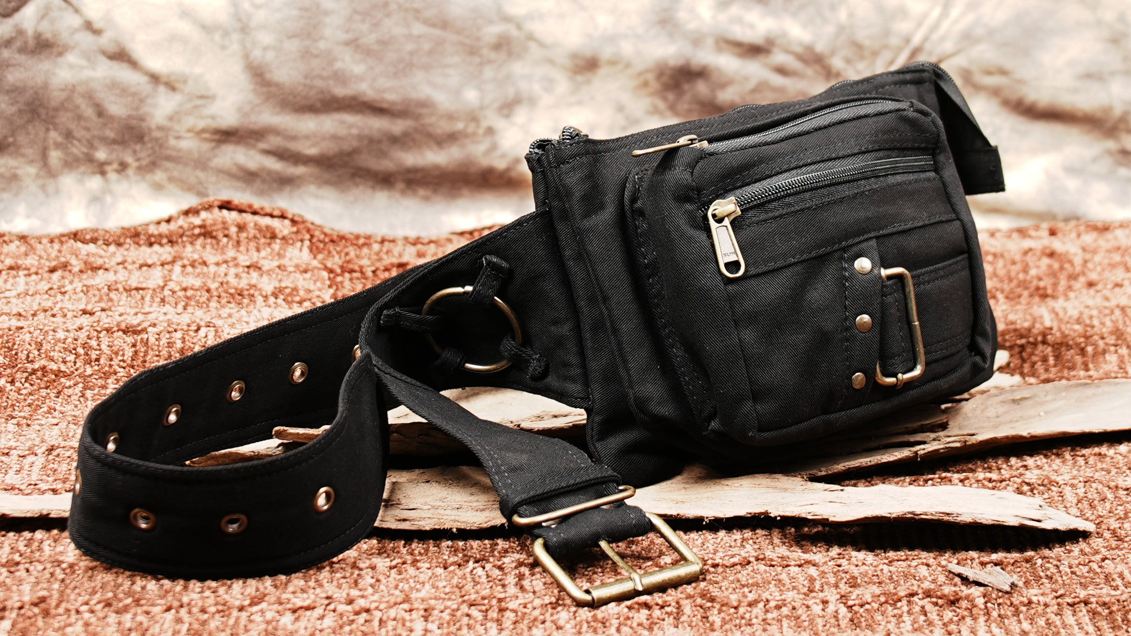 Handmade cotton hip bag with secure zipper pockets and metal accents