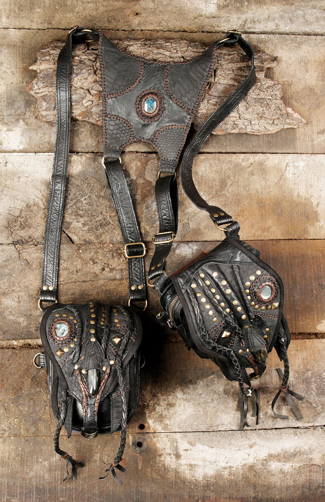 “Fantasy leather holster with reptile texture, braided edges, and gemstone accents”