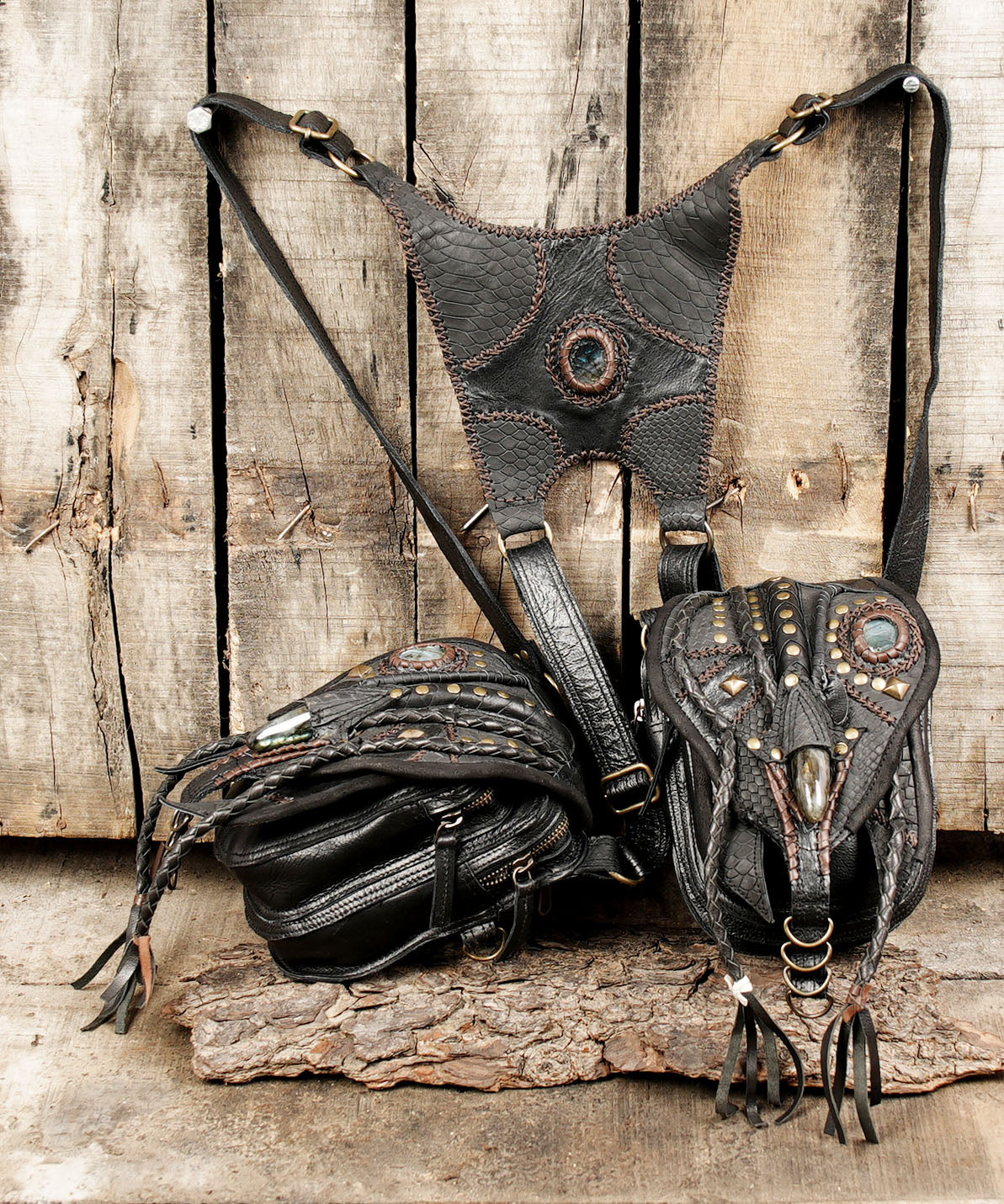 “Premium handmade snakeskin holster with stone medallions and rivets”