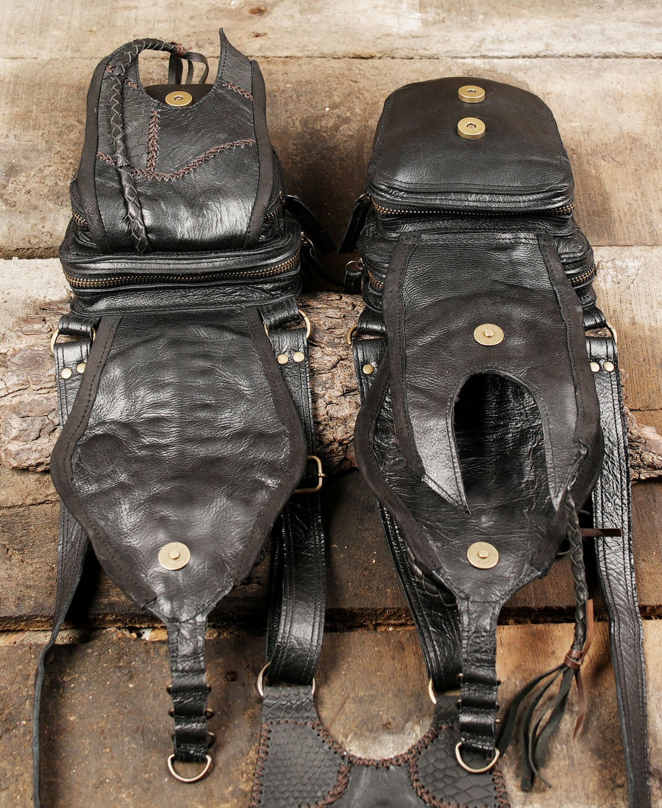 “Dual pouch artisan leather holster with carved details and braided tassels”