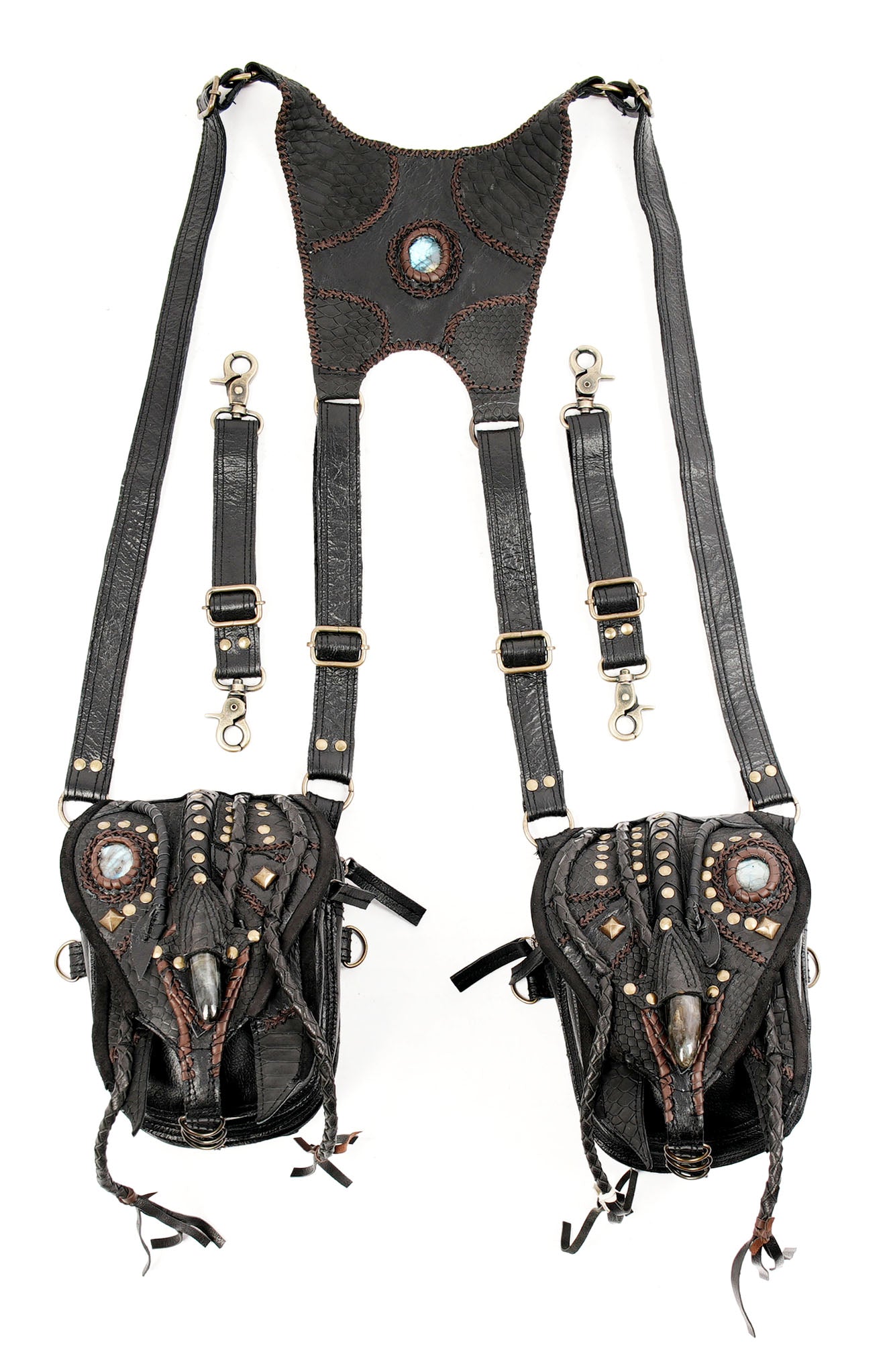 “Black leather utility holster with braided tassels and metal studs”