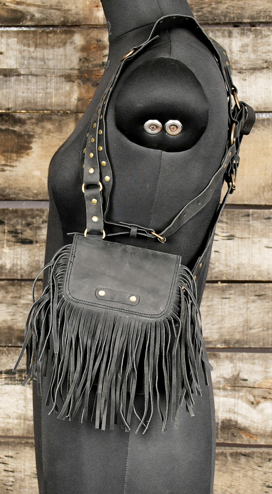Western style leather holster with tassel detailing
