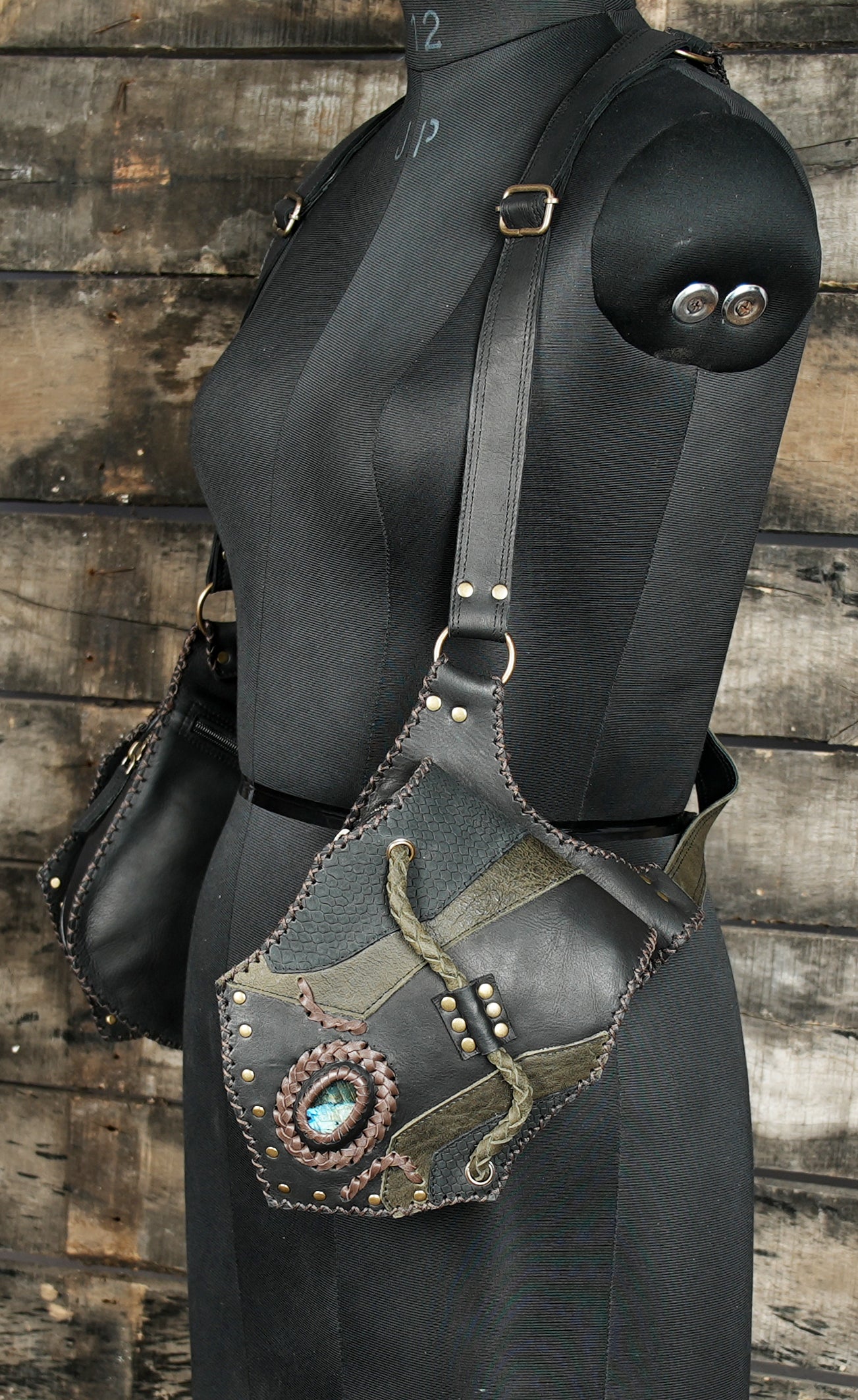Adjustable festival holster harness with dark green leather blend.
