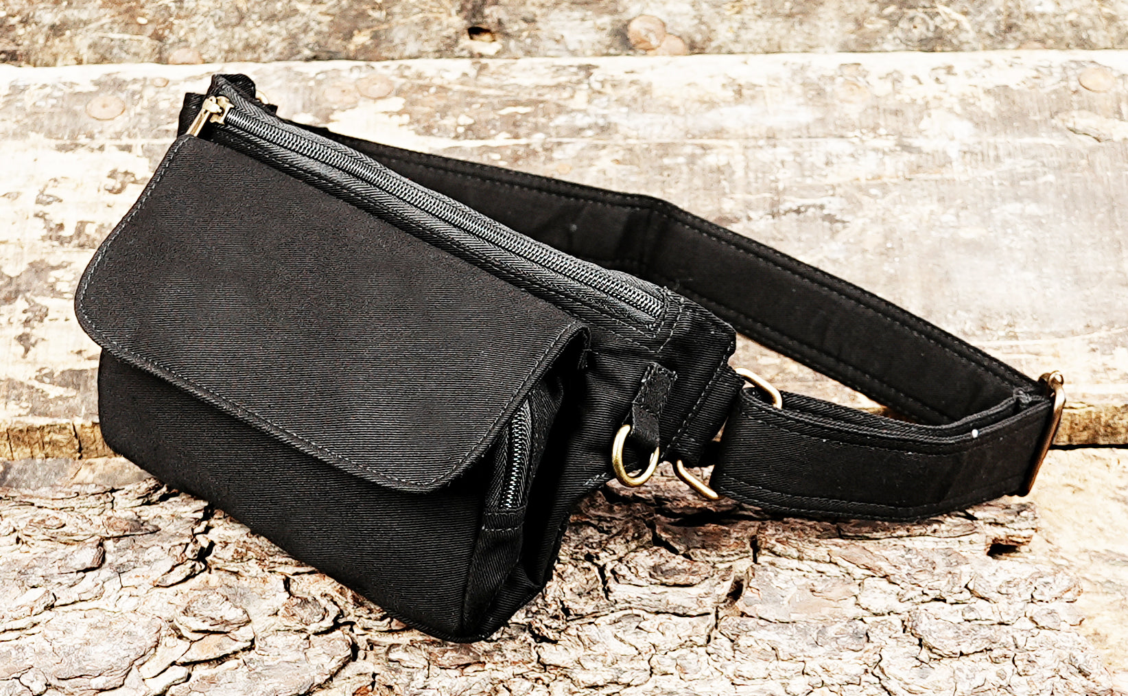Unisex black cotton hip bag with brass hardware details