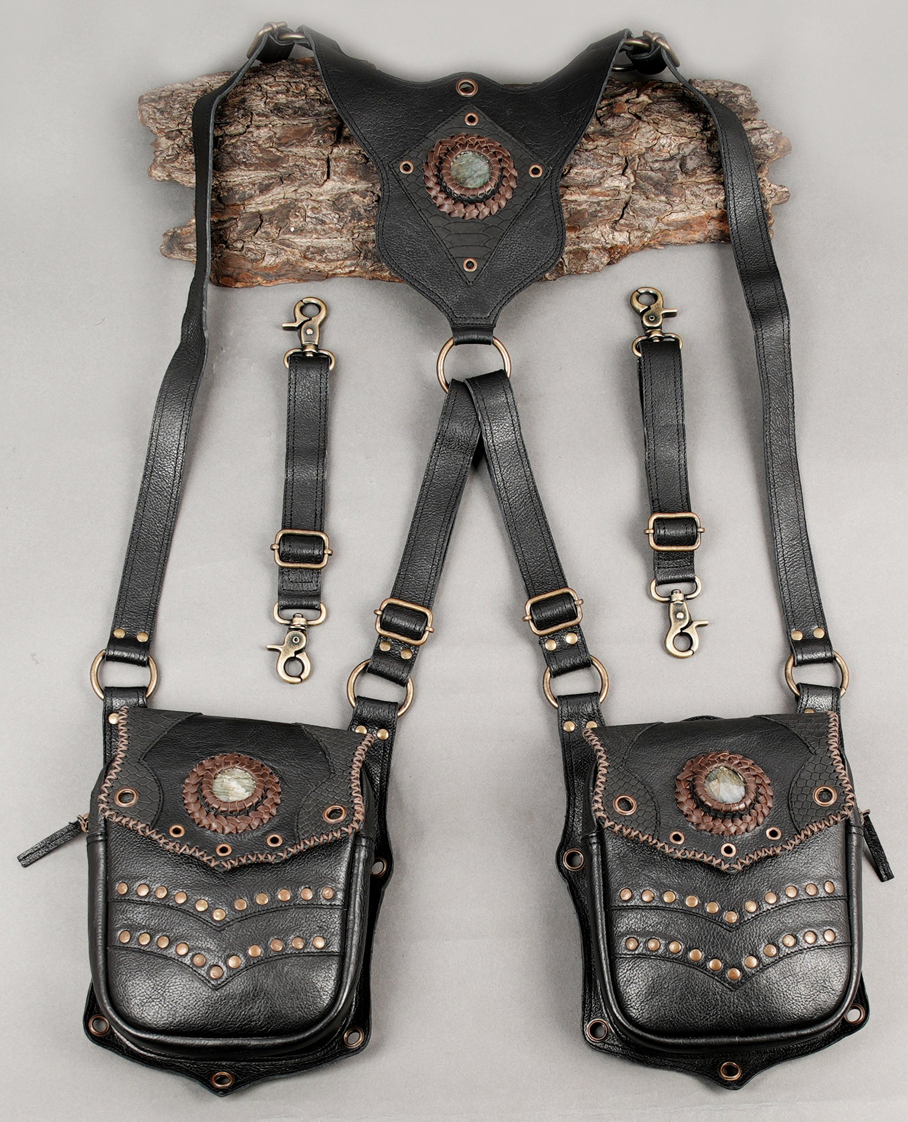 Handcrafted dual leather holster harness with adjustable straps and metal studs
