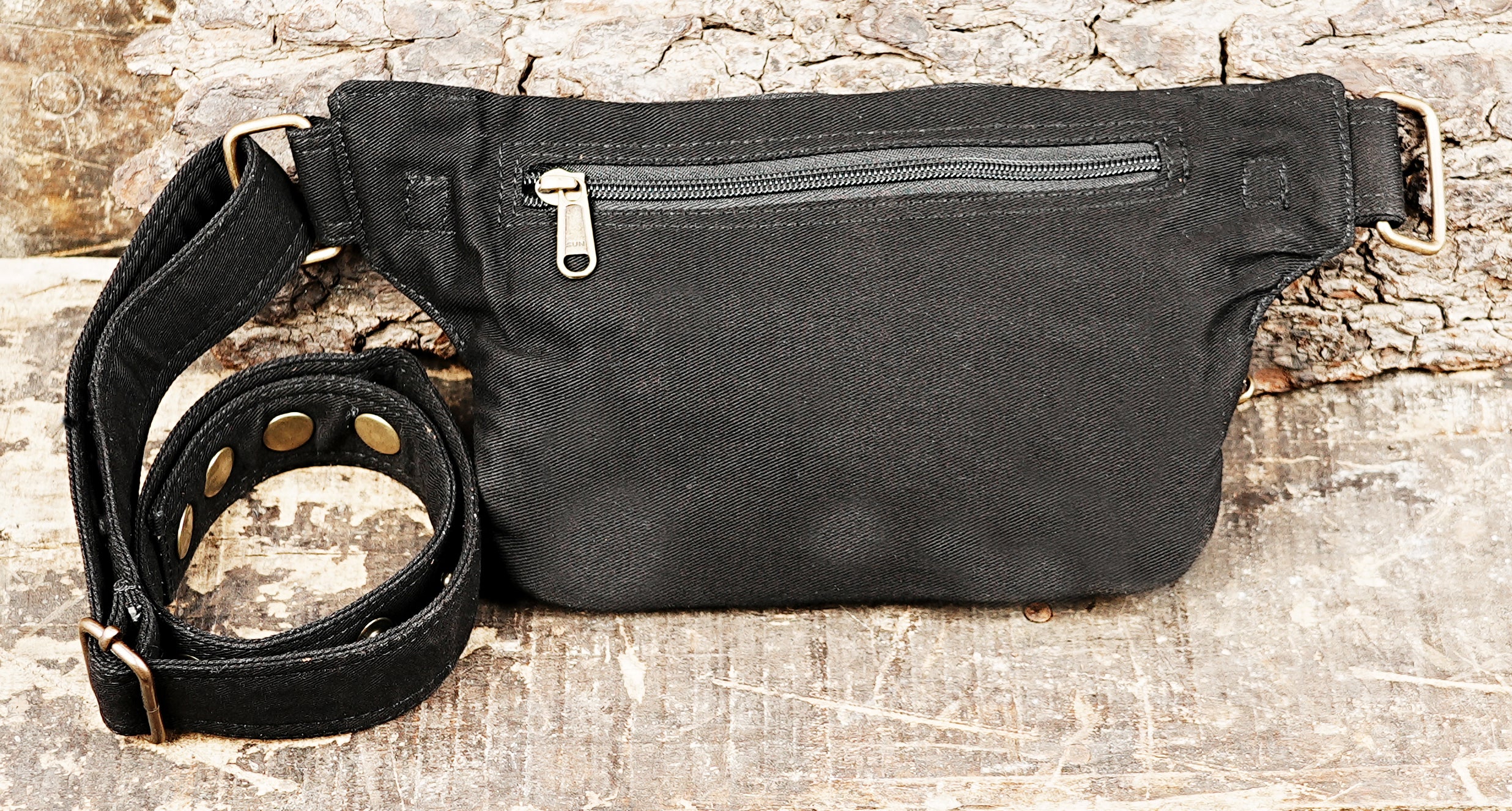 Travel bum bag in black fabric with secure zip compartments