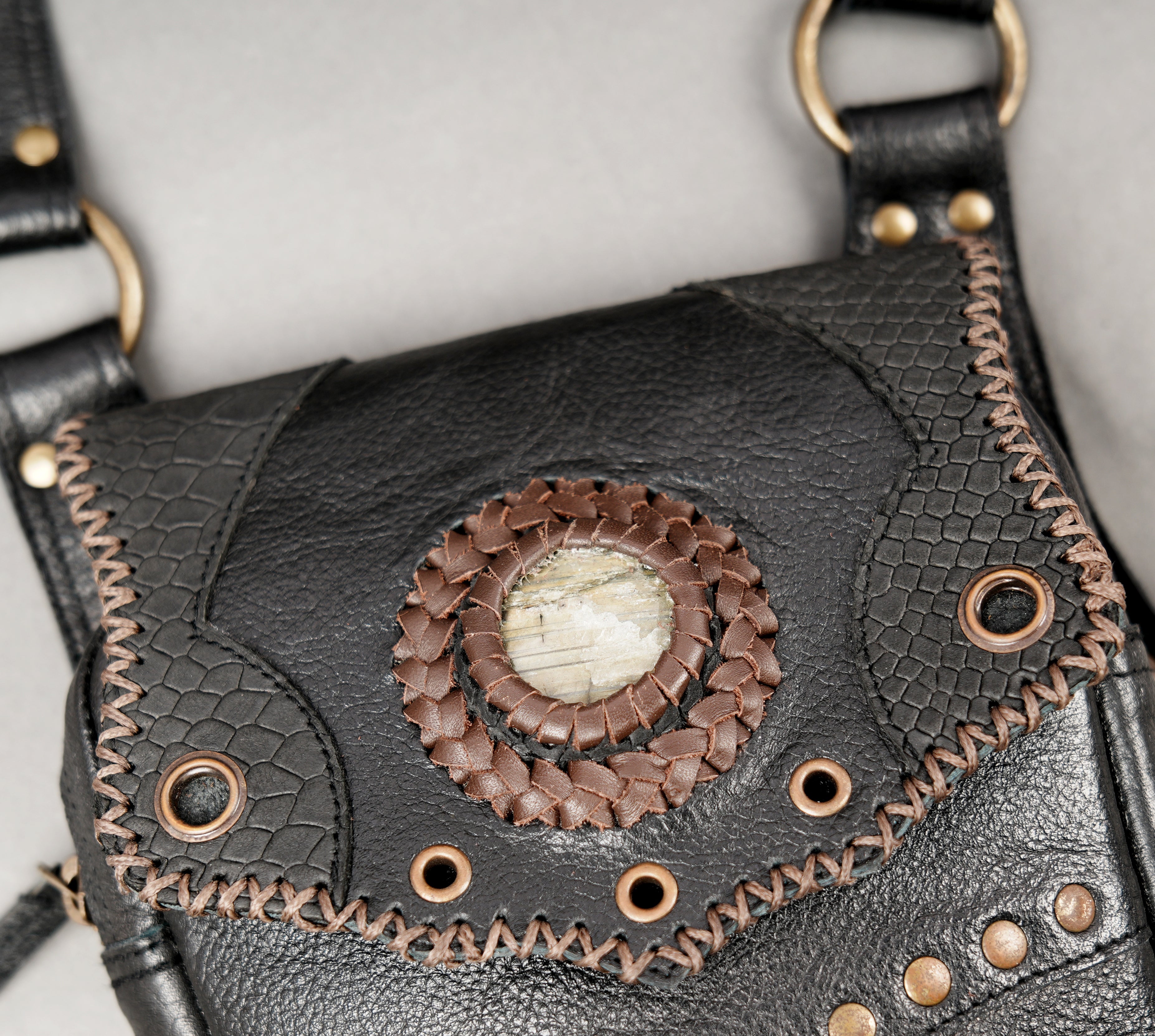 Artisan leather holster set with embossed patterns and rivets