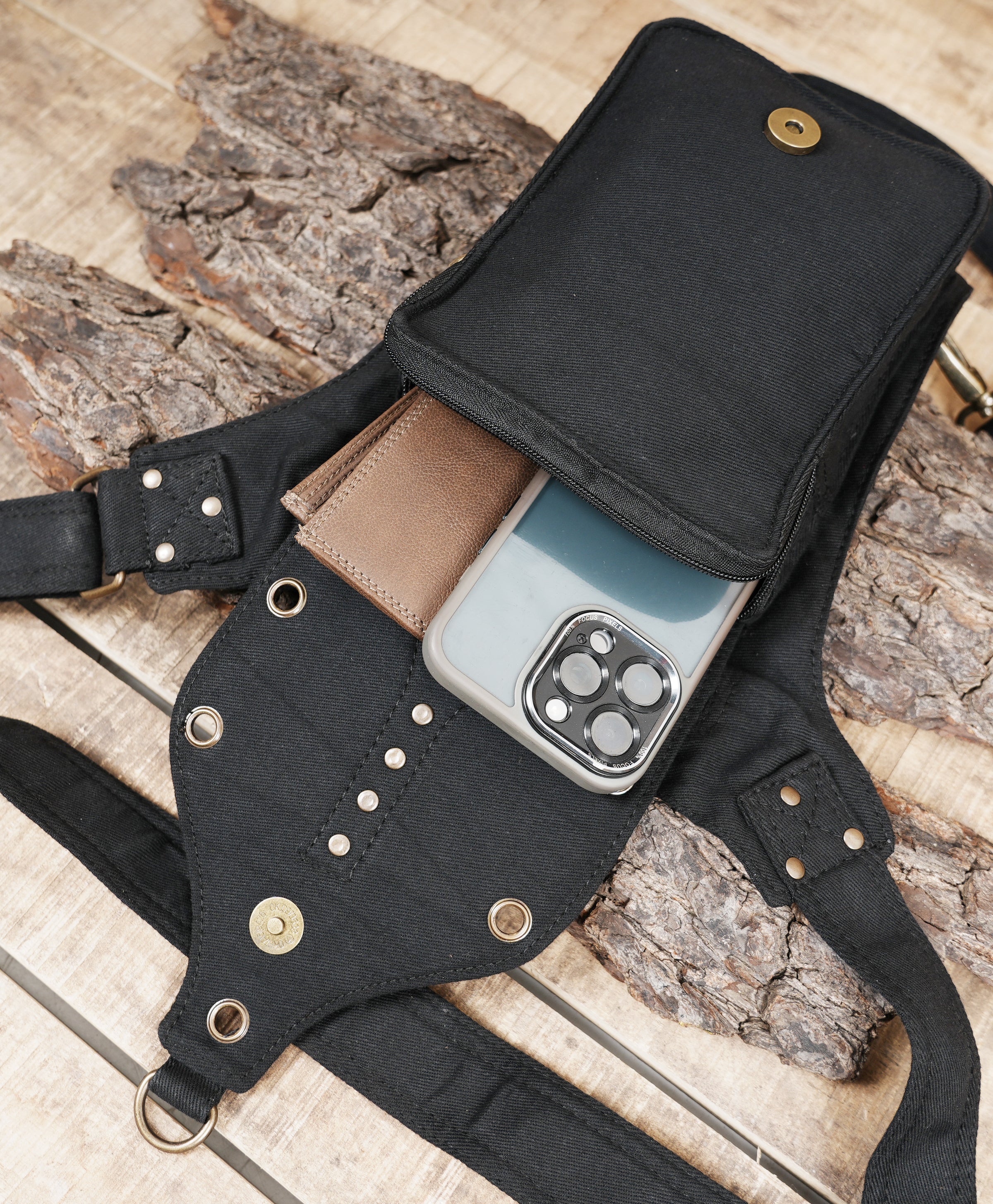 Waist pouch with thigh harness straps and metal rings