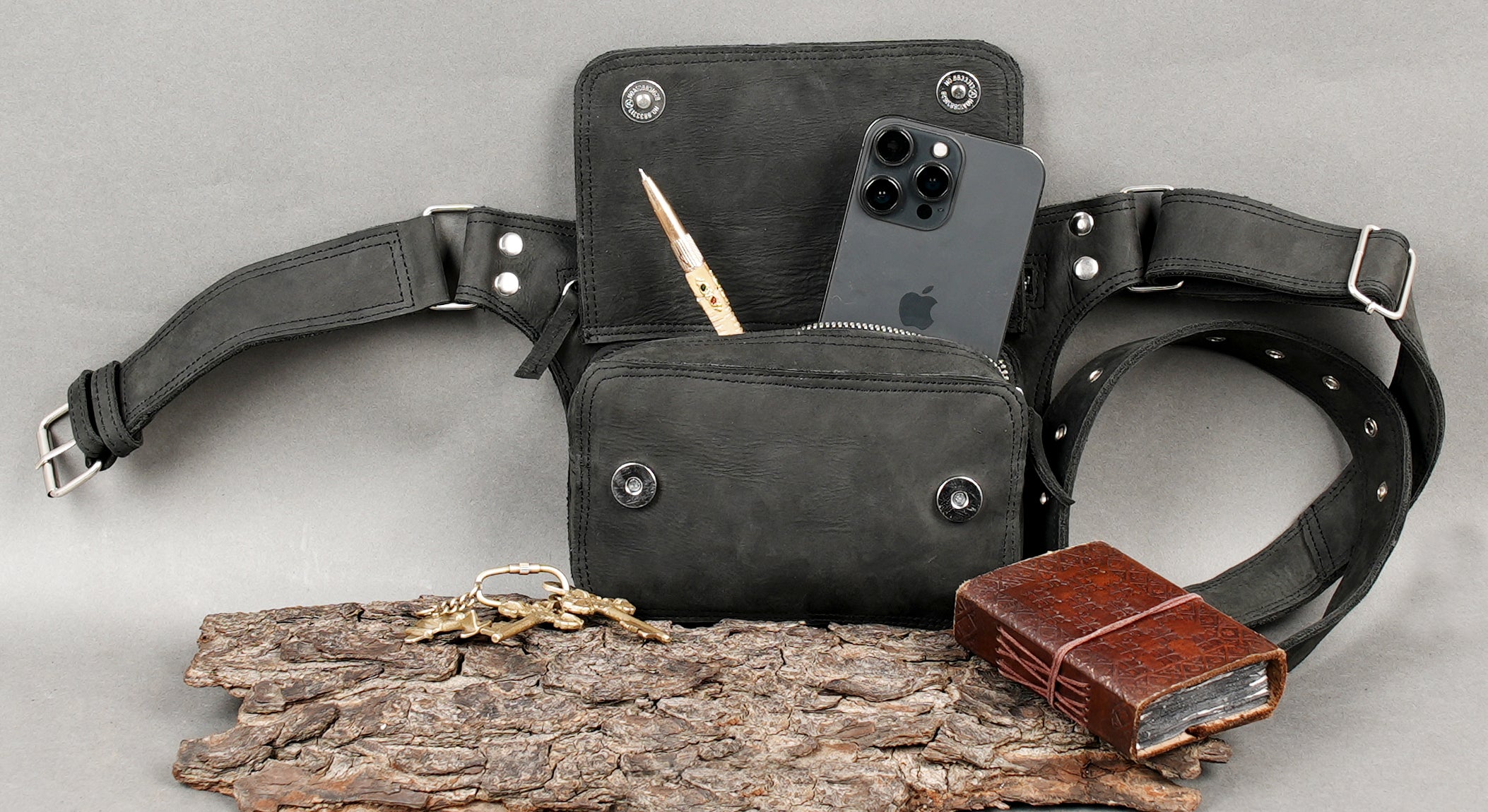 Adjustable black leather waist belt with metal hardware
