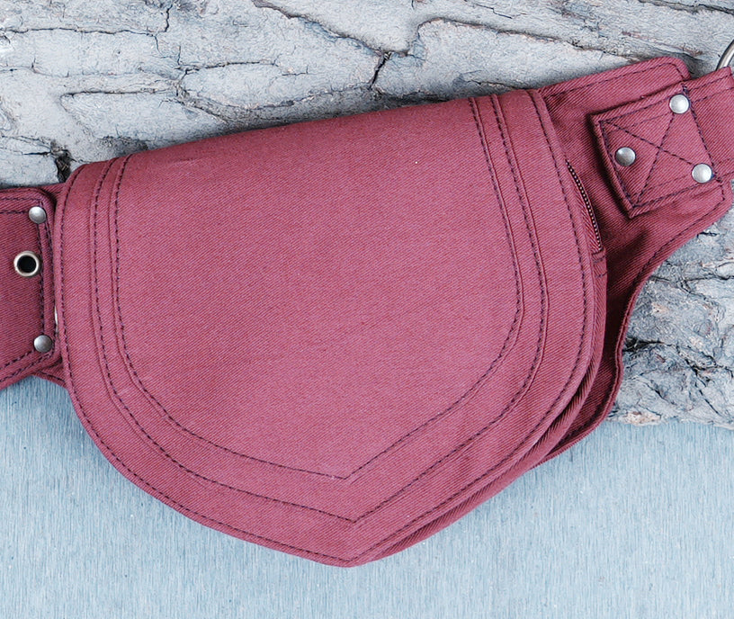 Alternative style canvas bum bag with unique pointed pouches and metal hardware.