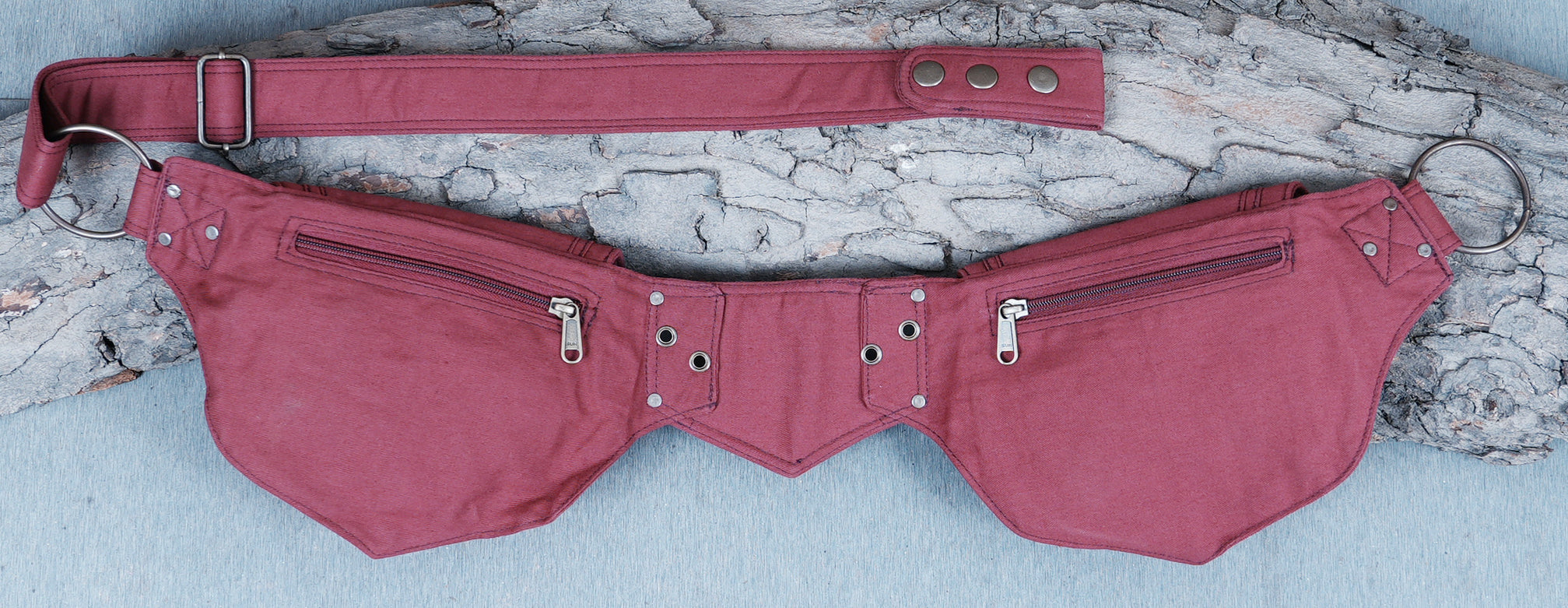 Functional canvas bum bag with two secure compartments and metal details.